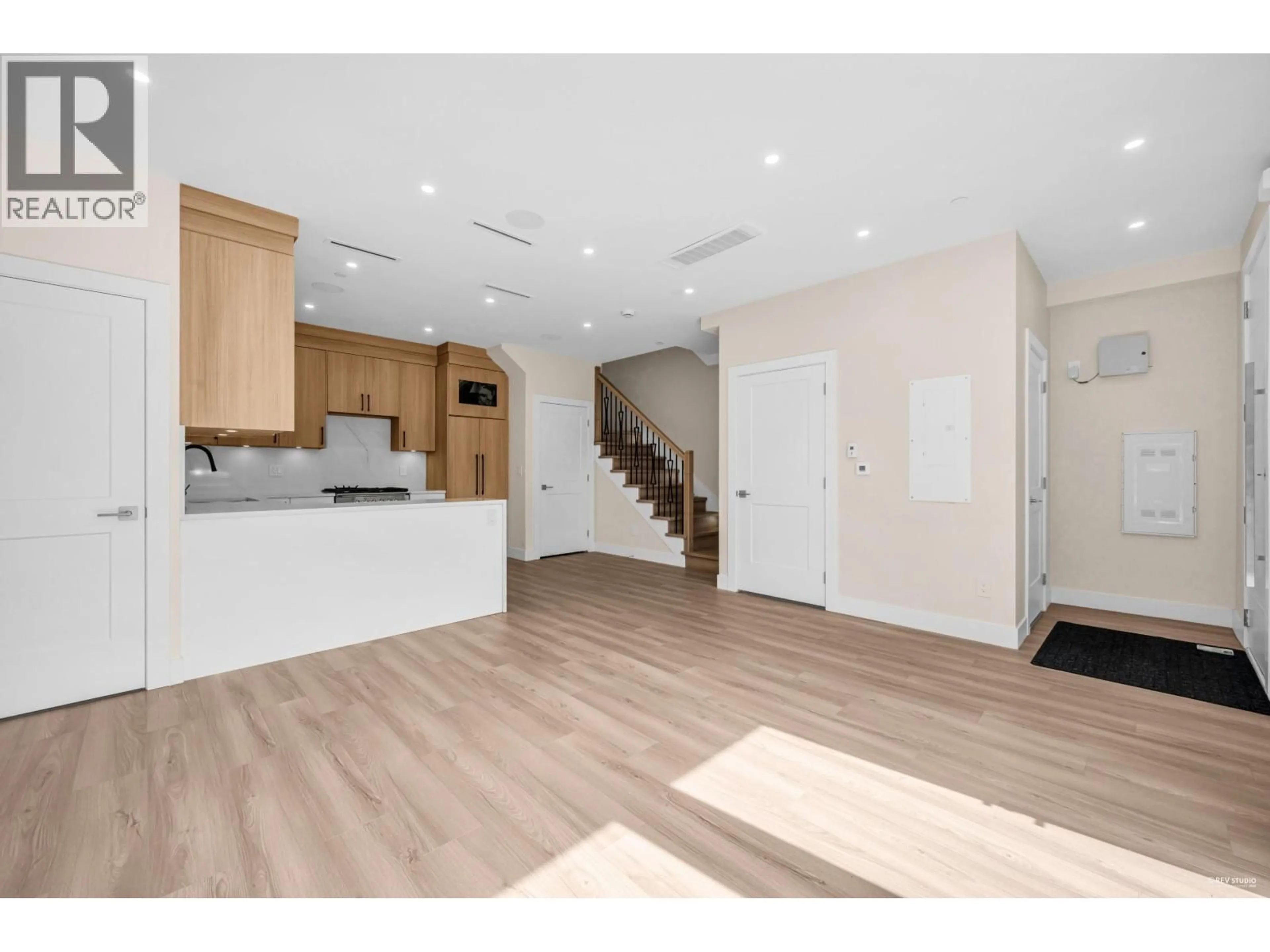 Open concept kitchen, wood/laminate floor for 2371 ADANAC STREET, Vancouver British Columbia V5L2E9