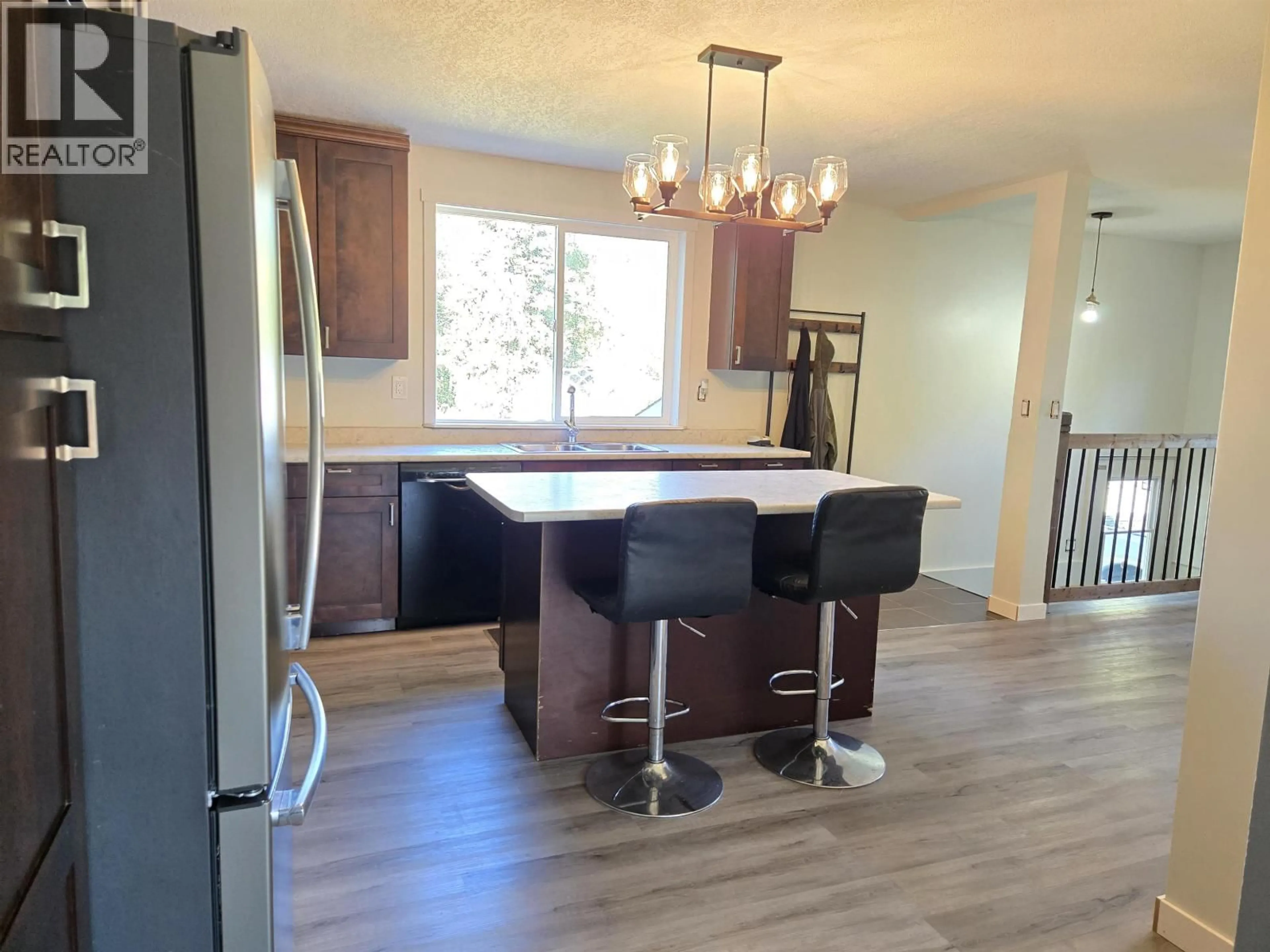 Open concept kitchen, wood/laminate floor for 9580 SIX MILE LAKE ROAD, Prince George British Columbia V2N6V3