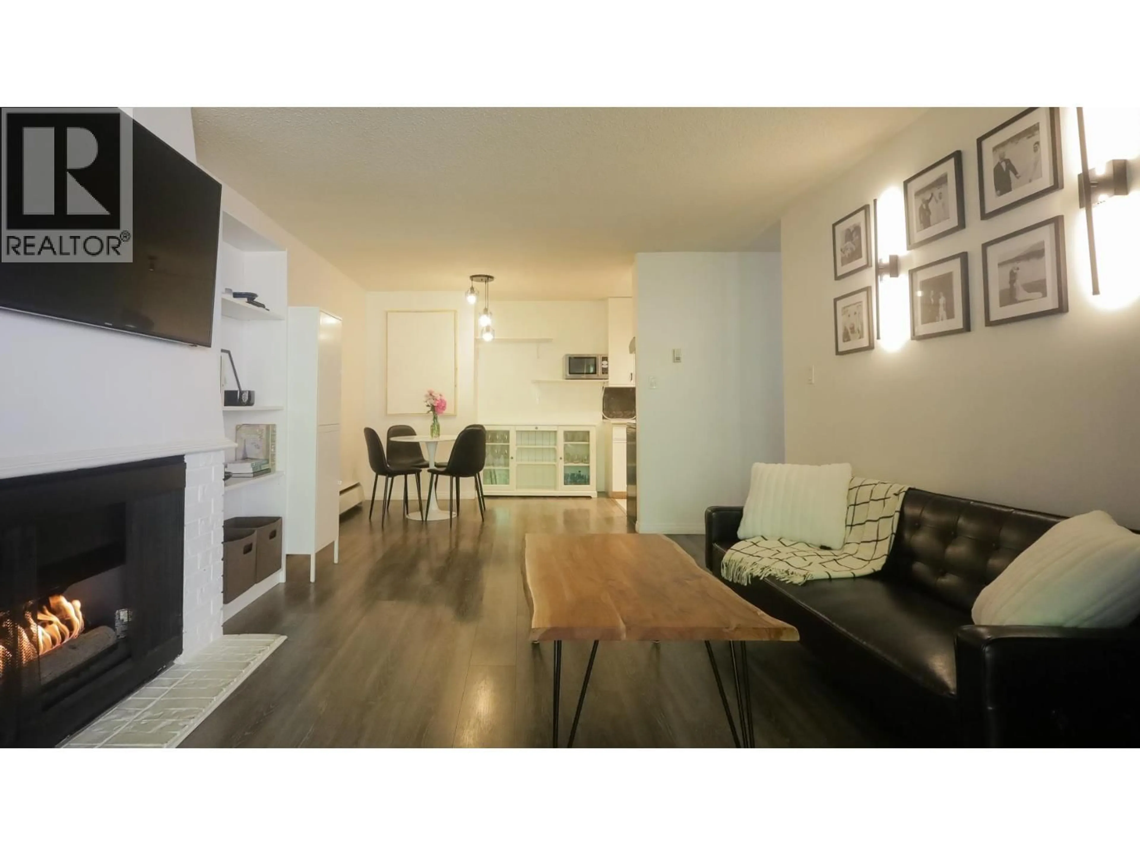 Living room with furniture, wood/laminate floor for 214 - 5340 HASTINGS STREET, Burnaby British Columbia V5B1R1