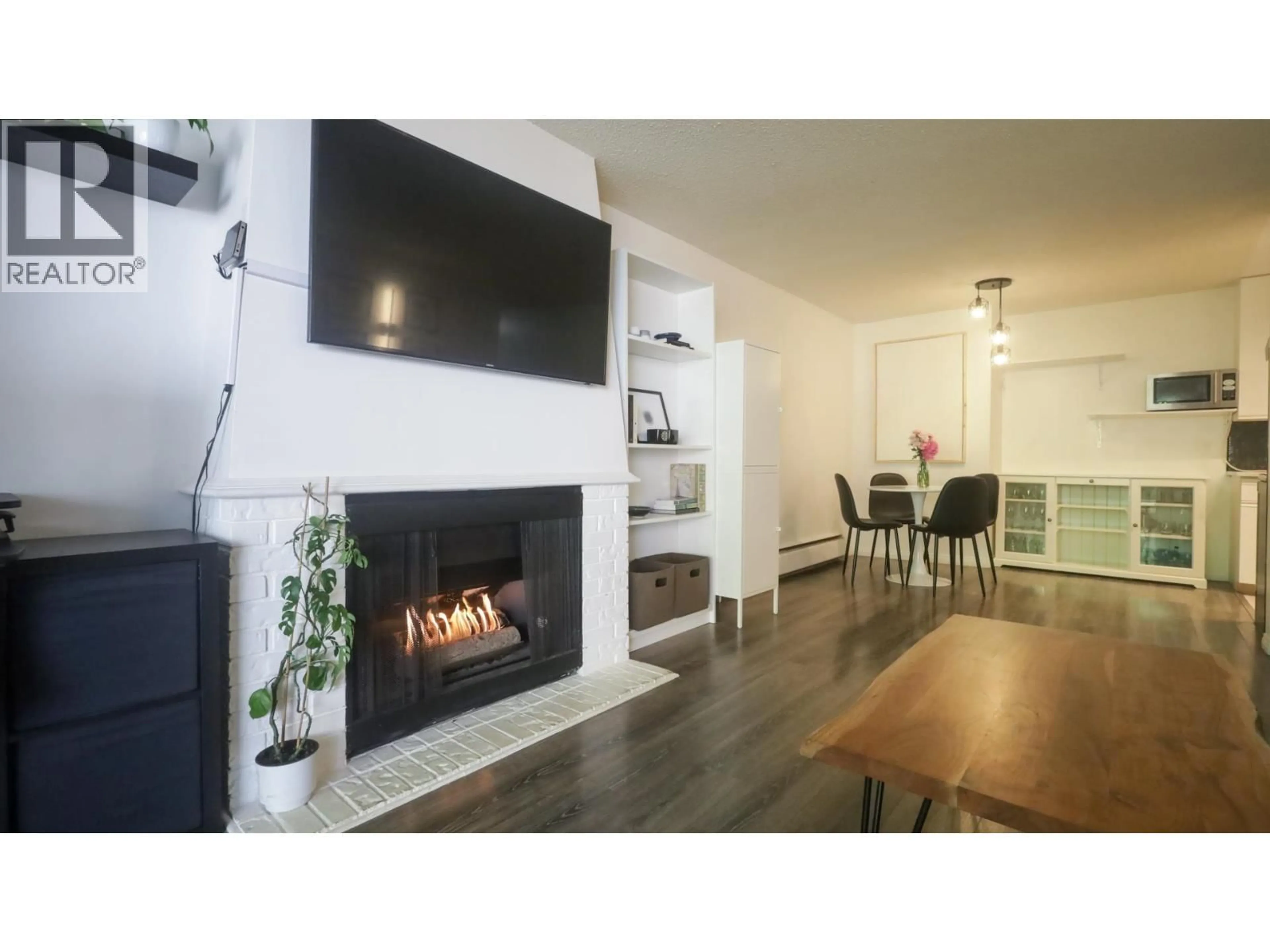 Living room with furniture, wood/laminate floor for 214 - 5340 HASTINGS STREET, Burnaby British Columbia V5B1R1