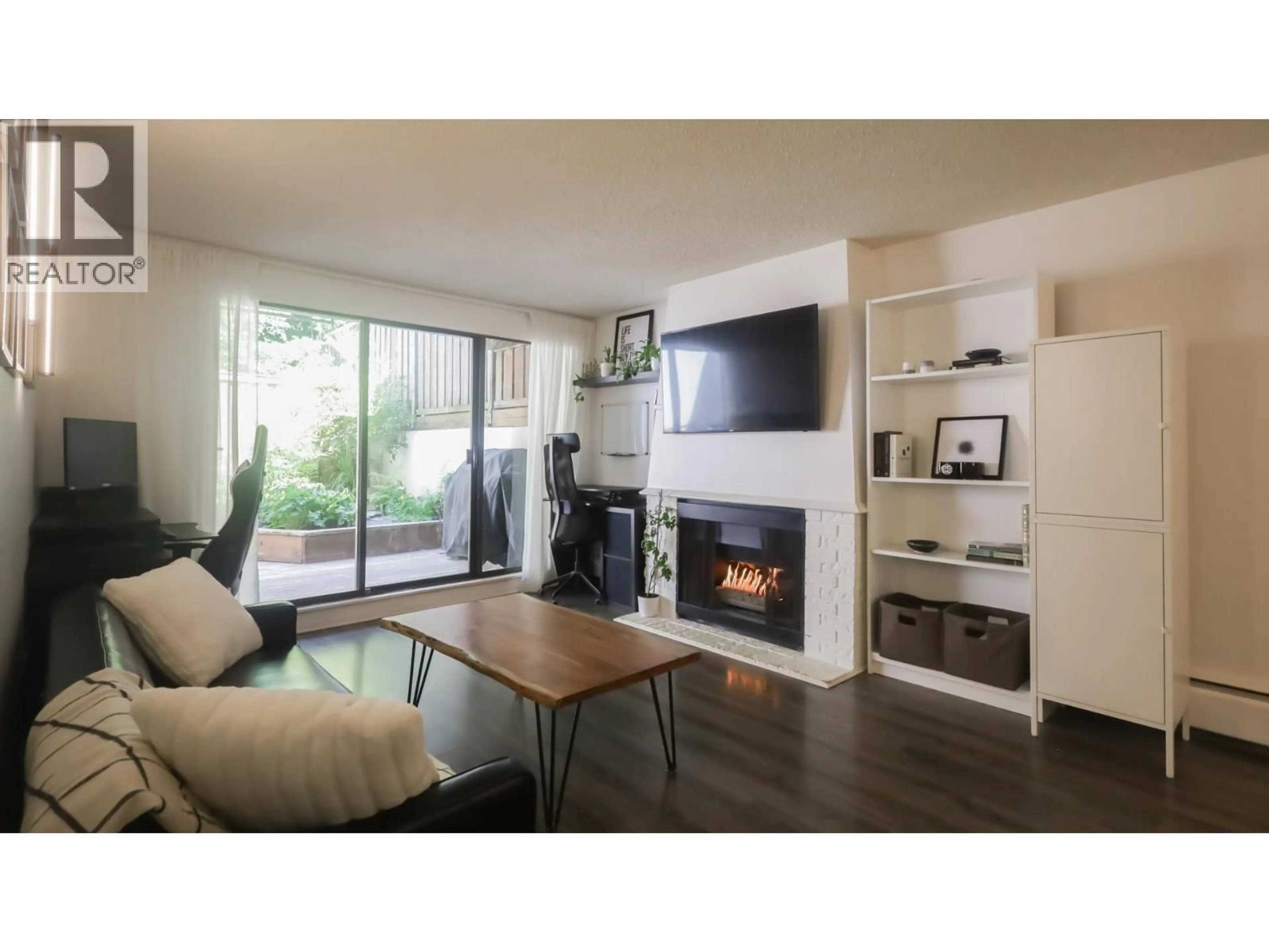Living room with furniture, wood/laminate floor for 214 - 5340 HASTINGS STREET, Burnaby British Columbia V5B1R1