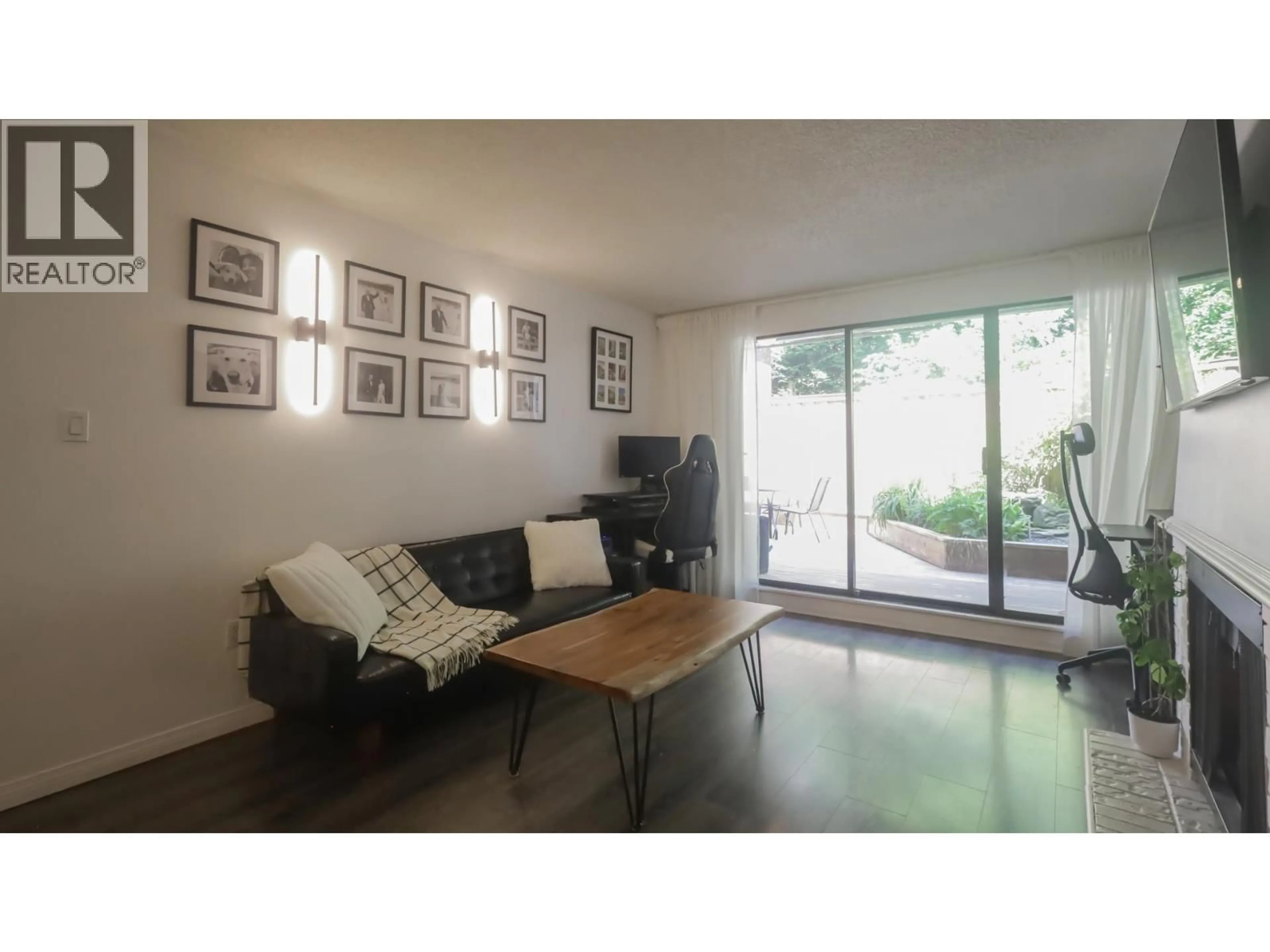 Living room with furniture, wood/laminate floor for 214 - 5340 HASTINGS STREET, Burnaby British Columbia V5B1R1