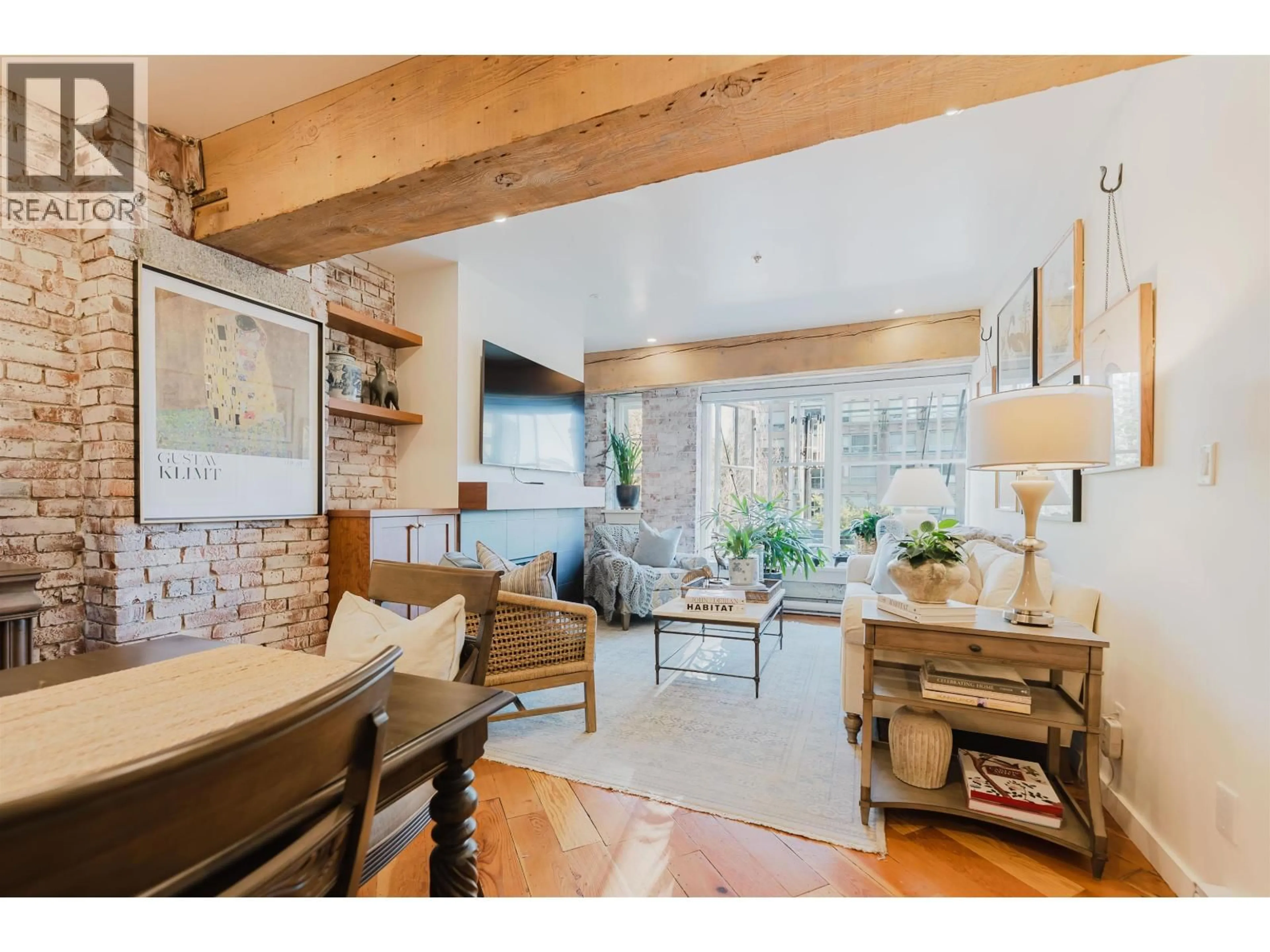 Living room with furniture, wood/laminate floor for 210 - 1178 HAMILTON STREET, Vancouver British Columbia V6B2S2