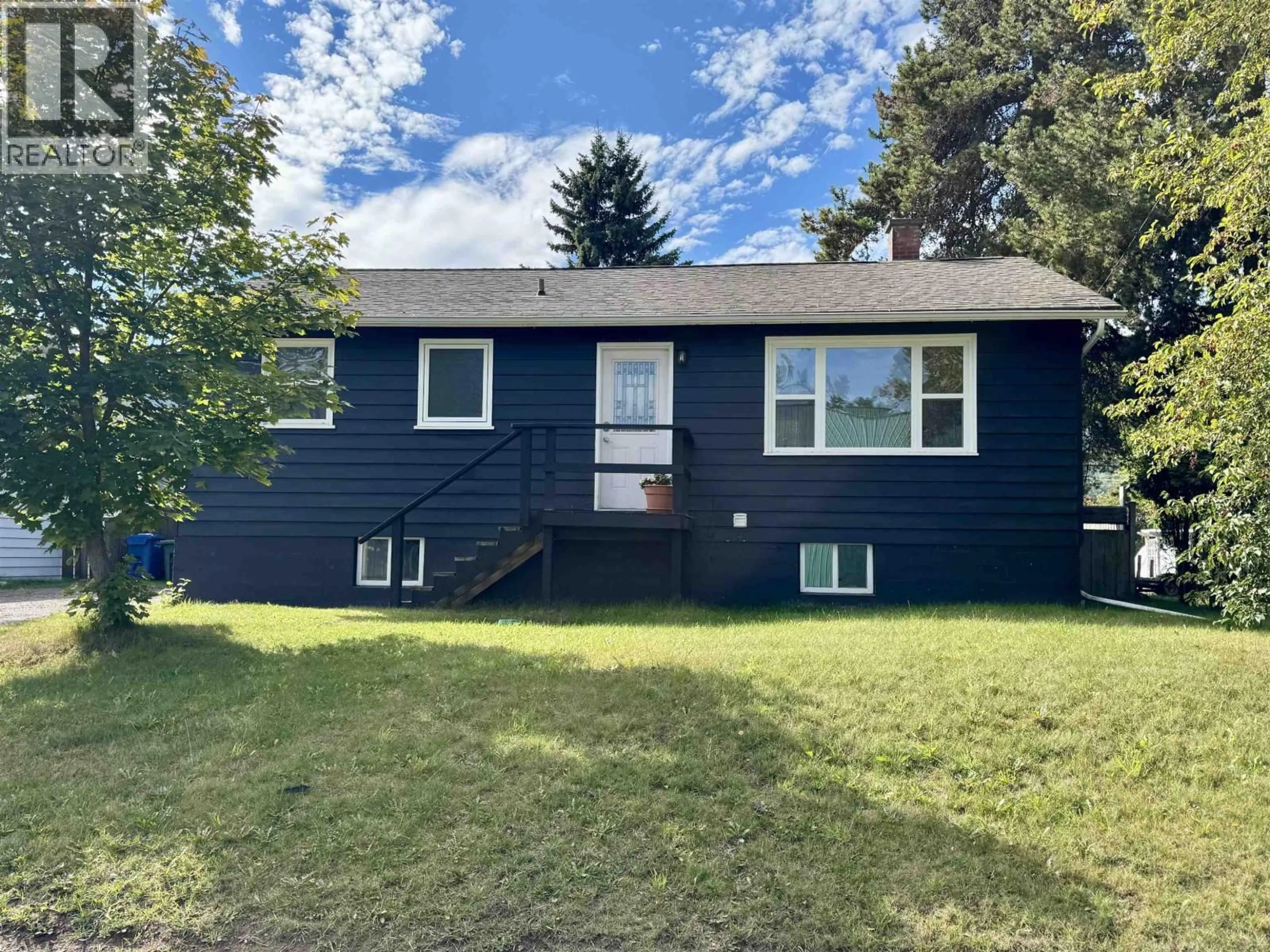 Home with vinyl exterior material, street for 4245 3RD AVENUE, Smithers British Columbia V0J2N0