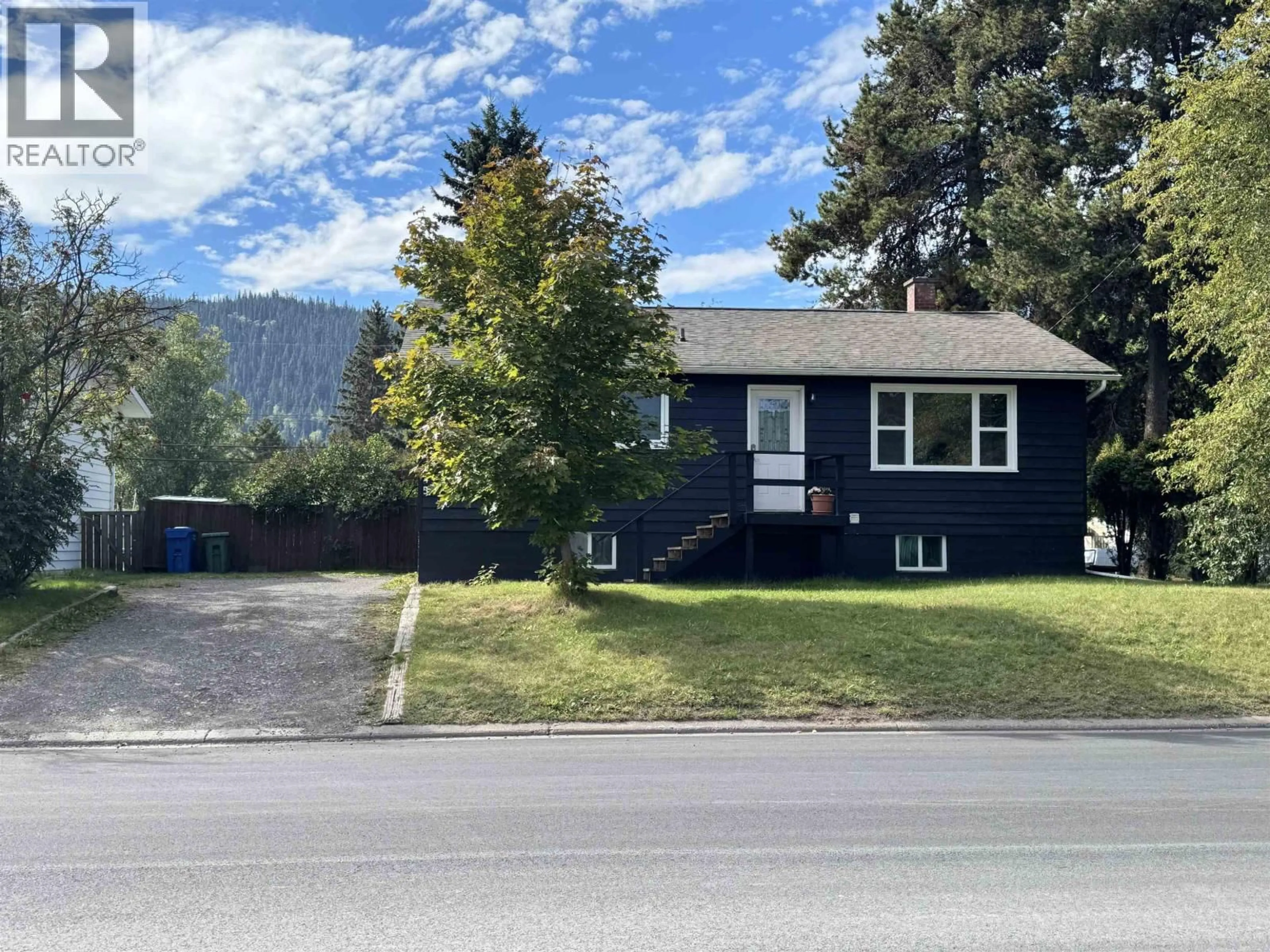 Home with vinyl exterior material, street for 4245 3RD AVENUE, Smithers British Columbia V0J2N0