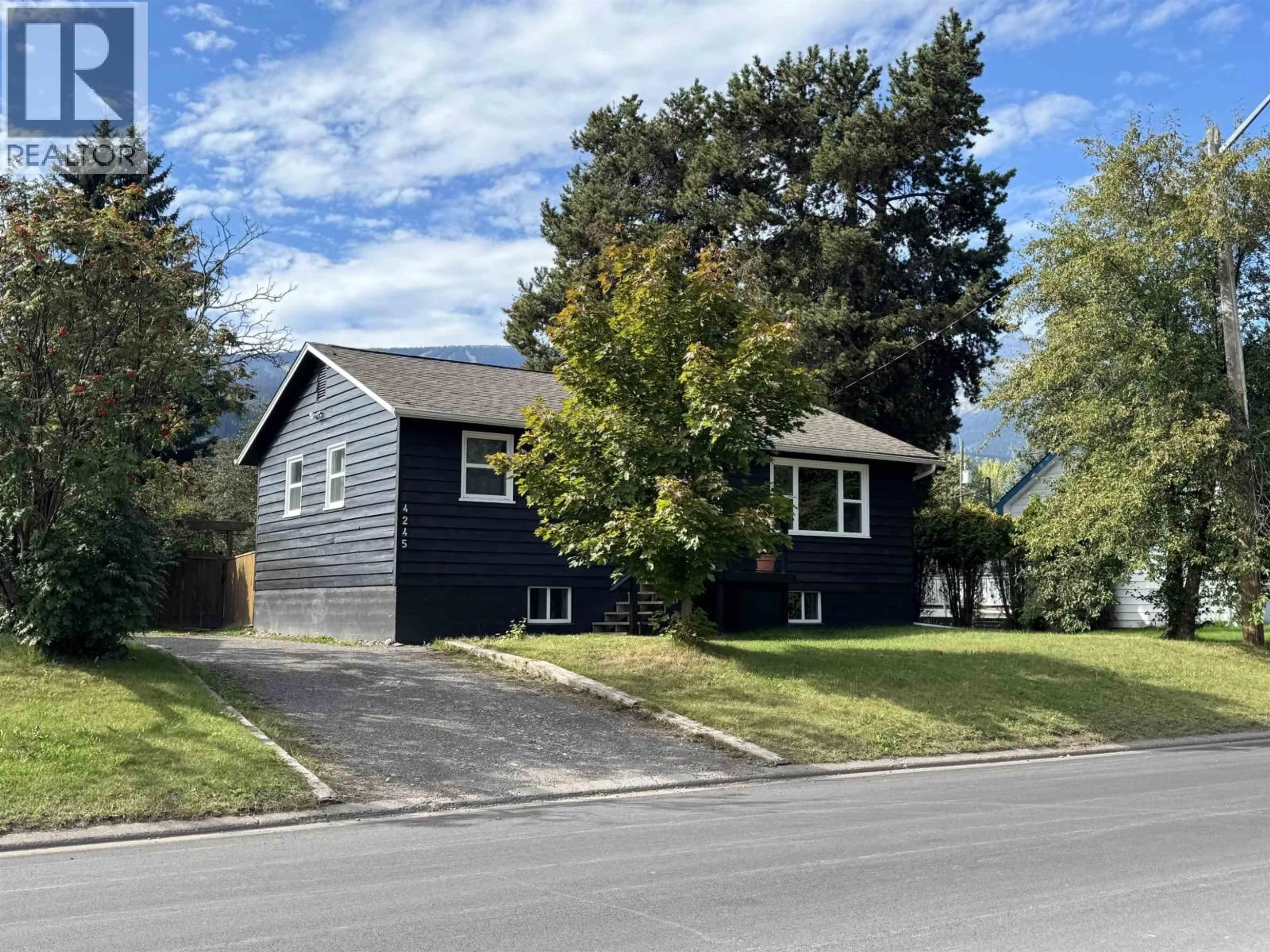 Home with vinyl exterior material, street for 4245 3RD AVENUE, Smithers British Columbia V0J2N0