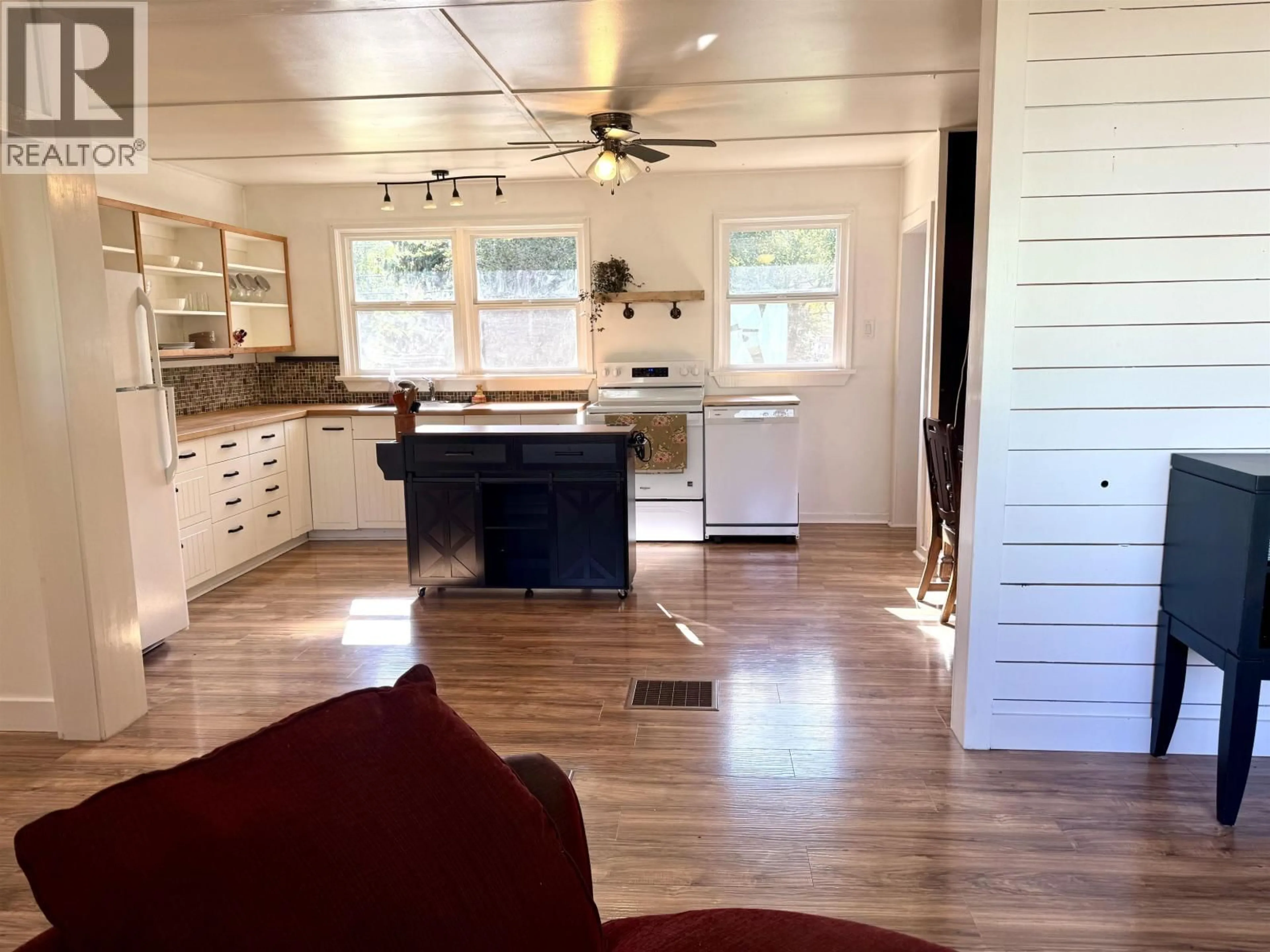 Open concept kitchen, wood/laminate floor for 4245 3RD AVENUE, Smithers British Columbia V0J2N0