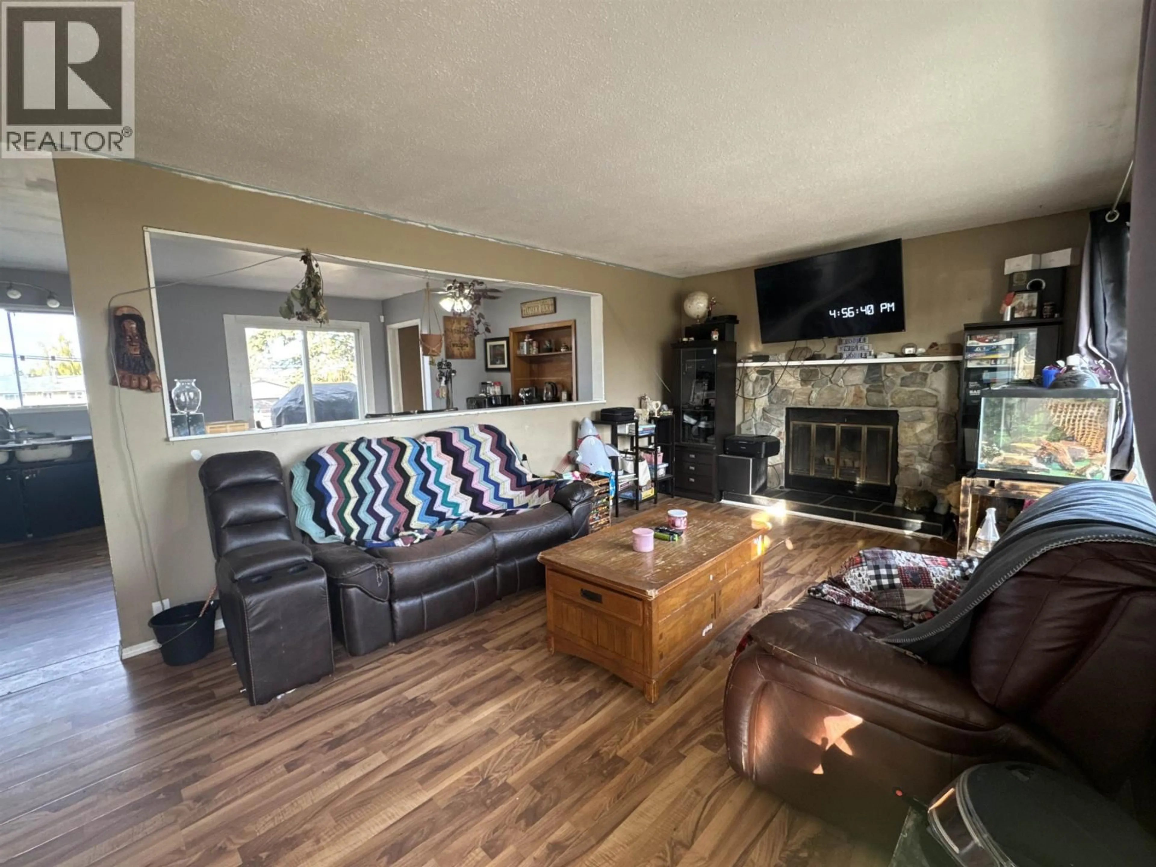 Living room with furniture, wood/laminate floor for 9808 112 AVENUE, Fort St. John British Columbia V1J2W5