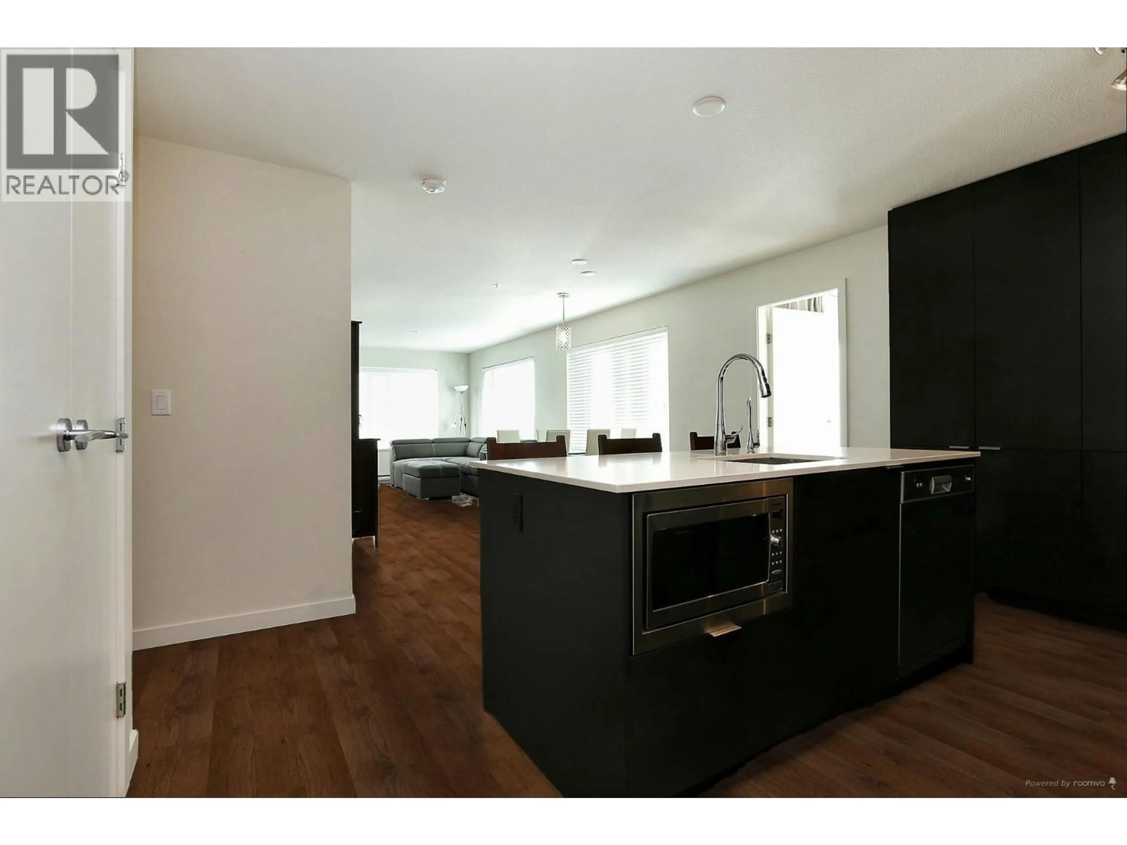 Open concept kitchen, wood/laminate floor for 306 - 1673 LLOYD AVENUE, North Vancouver British Columbia V7P0A9