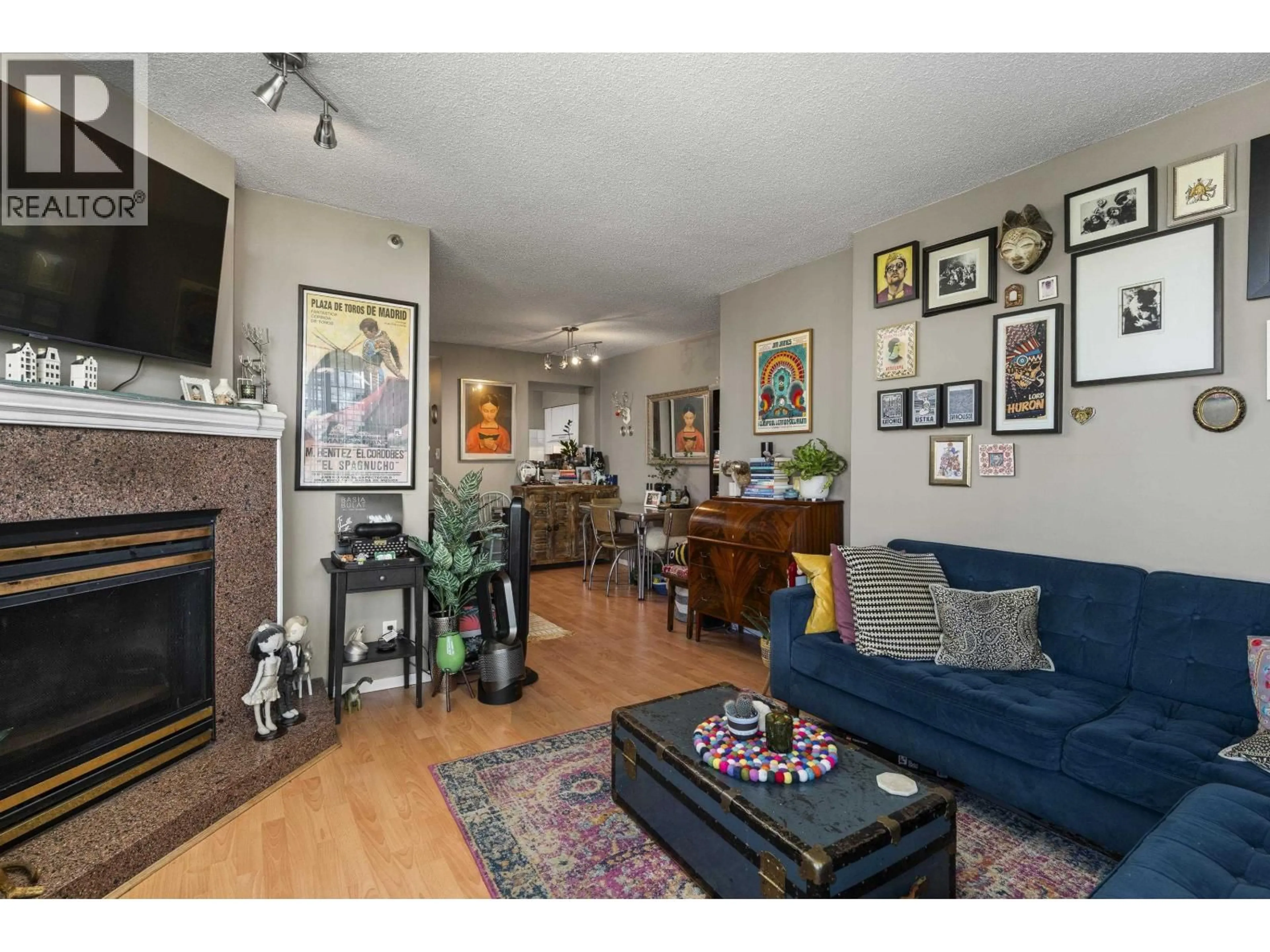 Living room with furniture, wood/laminate floor for 601 - 1771 NELSON STREET, Vancouver British Columbia V6G1M6