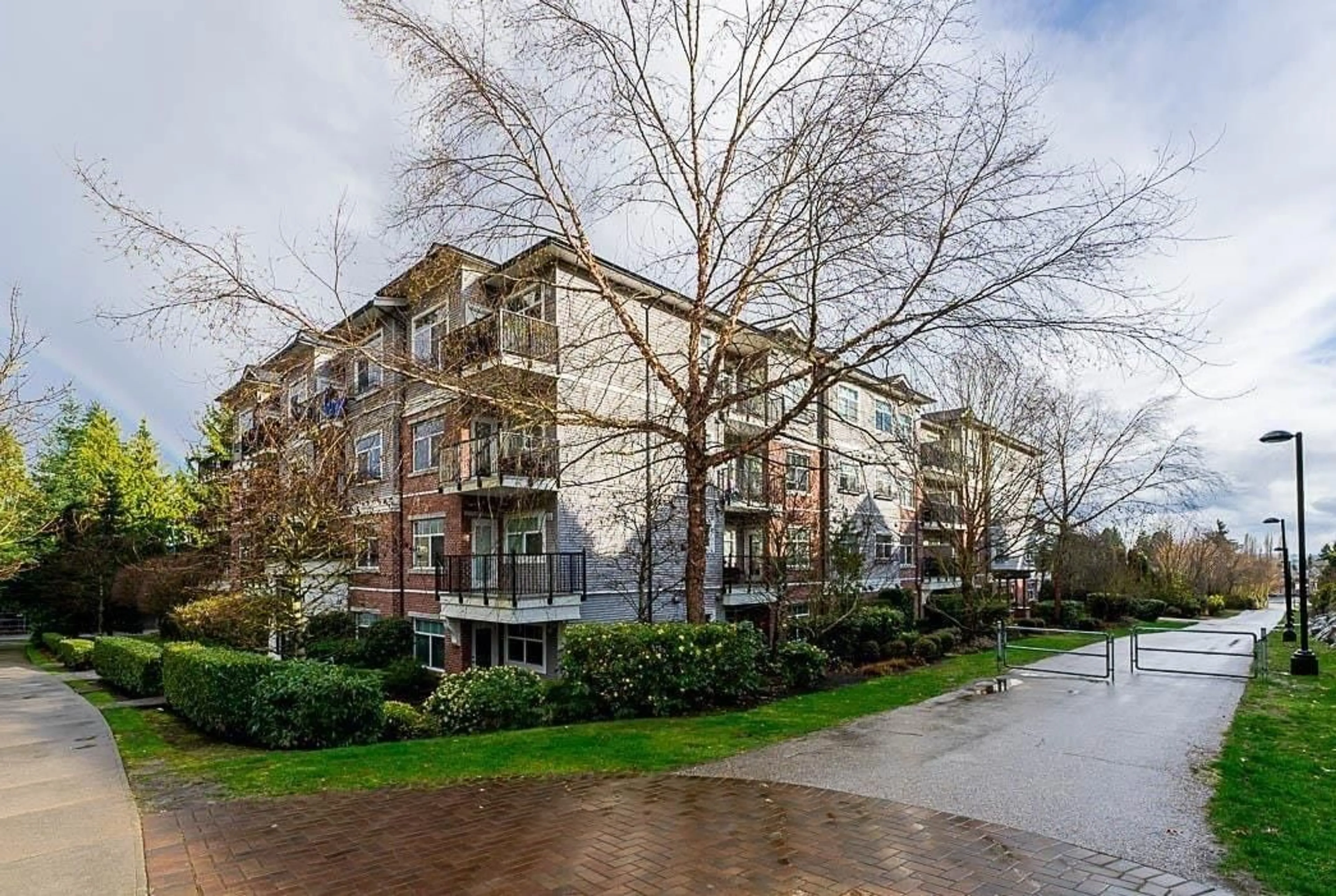 A pic from outside/outdoor area/front of a property/back of a property/a pic from drone, street for 107 - 19530 65, Surrey British Columbia V4N6M1