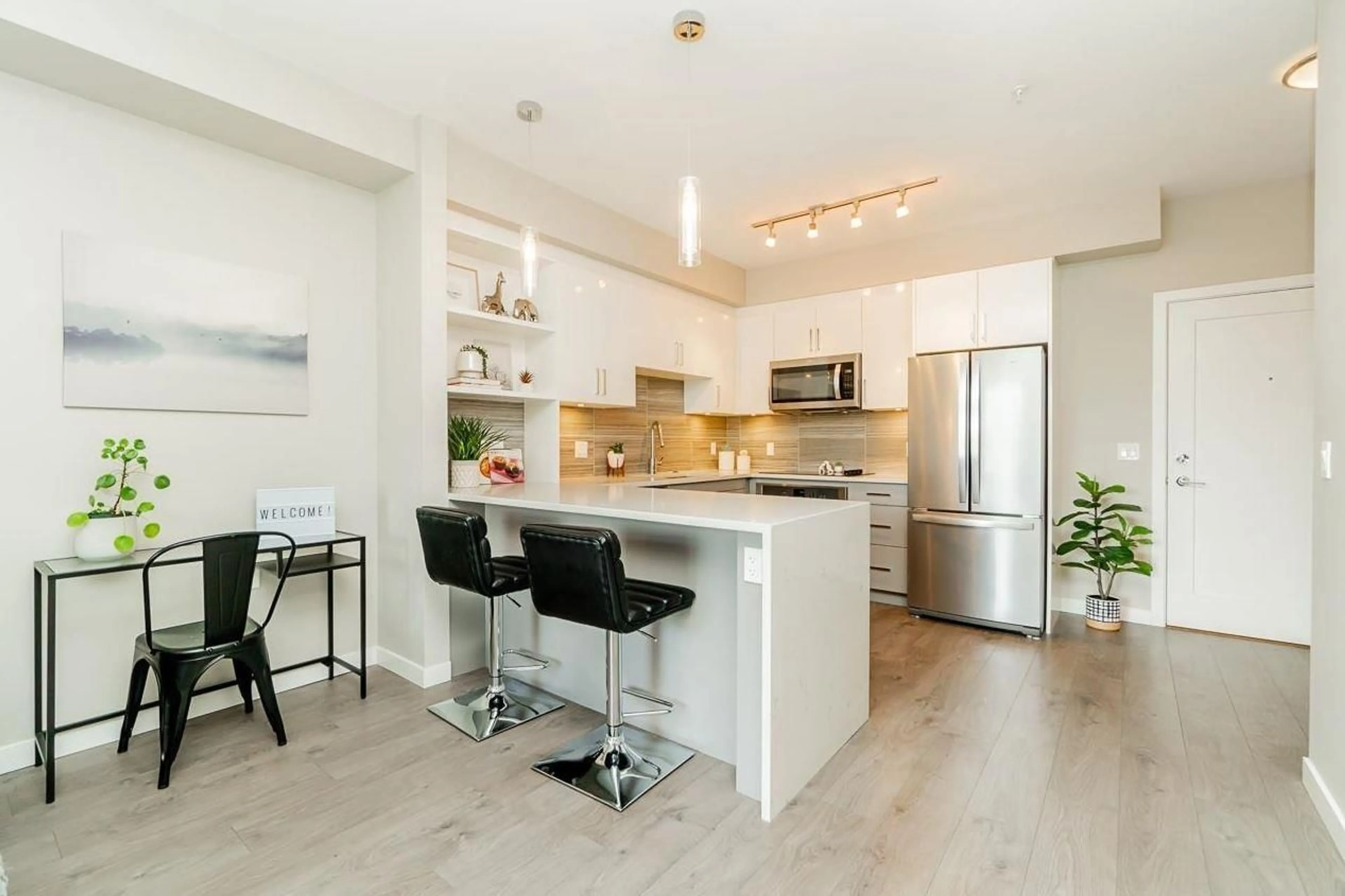 Open concept kitchen, wood/laminate floor for F306 - 20211 66, Langley British Columbia V2Y0L4