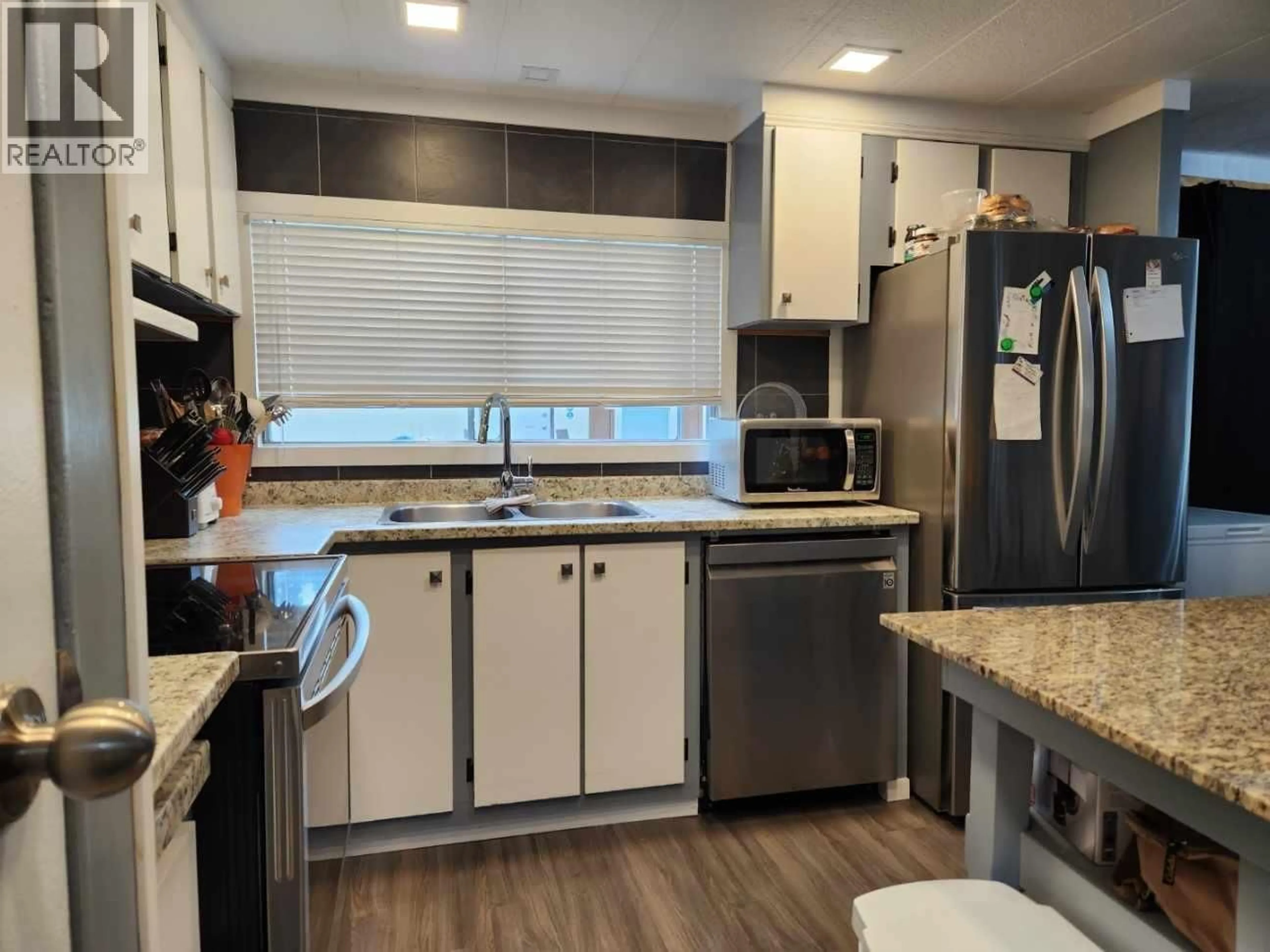 Open concept kitchen, wood/laminate floor for 34 - 8474 BUNCE ROAD, Prince George British Columbia V2N6Y8