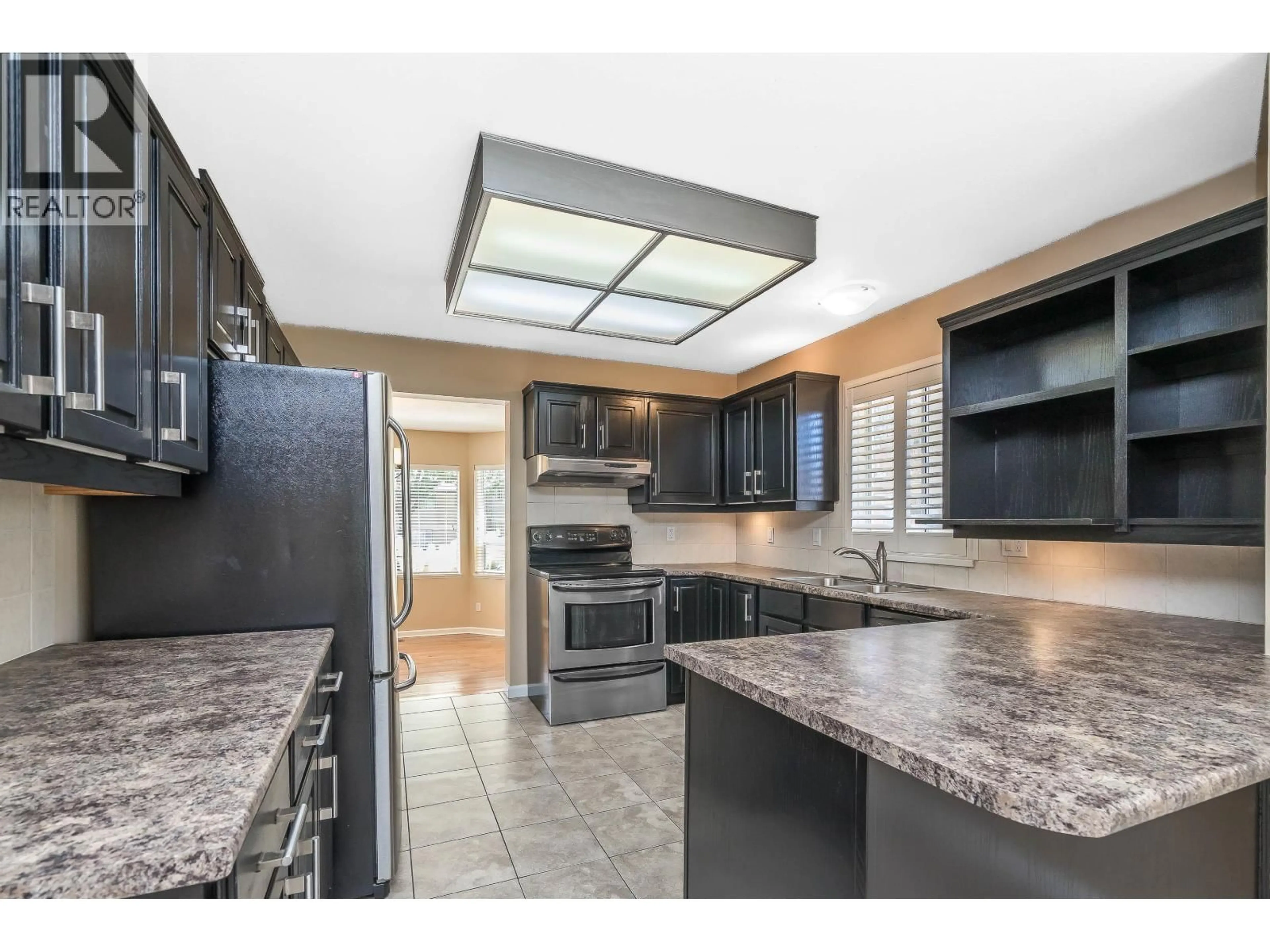 Open concept kitchen, ceramic/tile floor for 915 CITADEL DRIVE, Port Coquitlam British Columbia V3C5J2