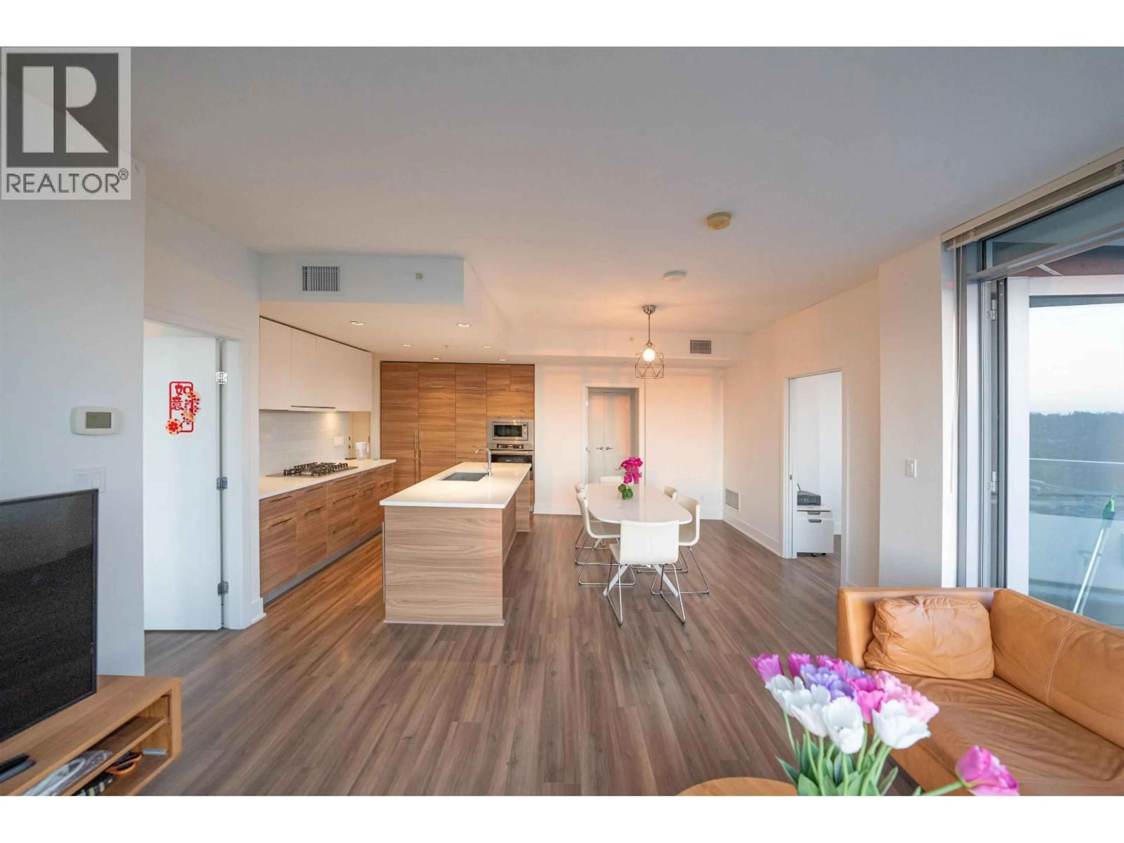 Open concept kitchen, wood/laminate floor for 4201 - 1188 PINETREE WAY, Coquitlam British Columbia V3B0K9
