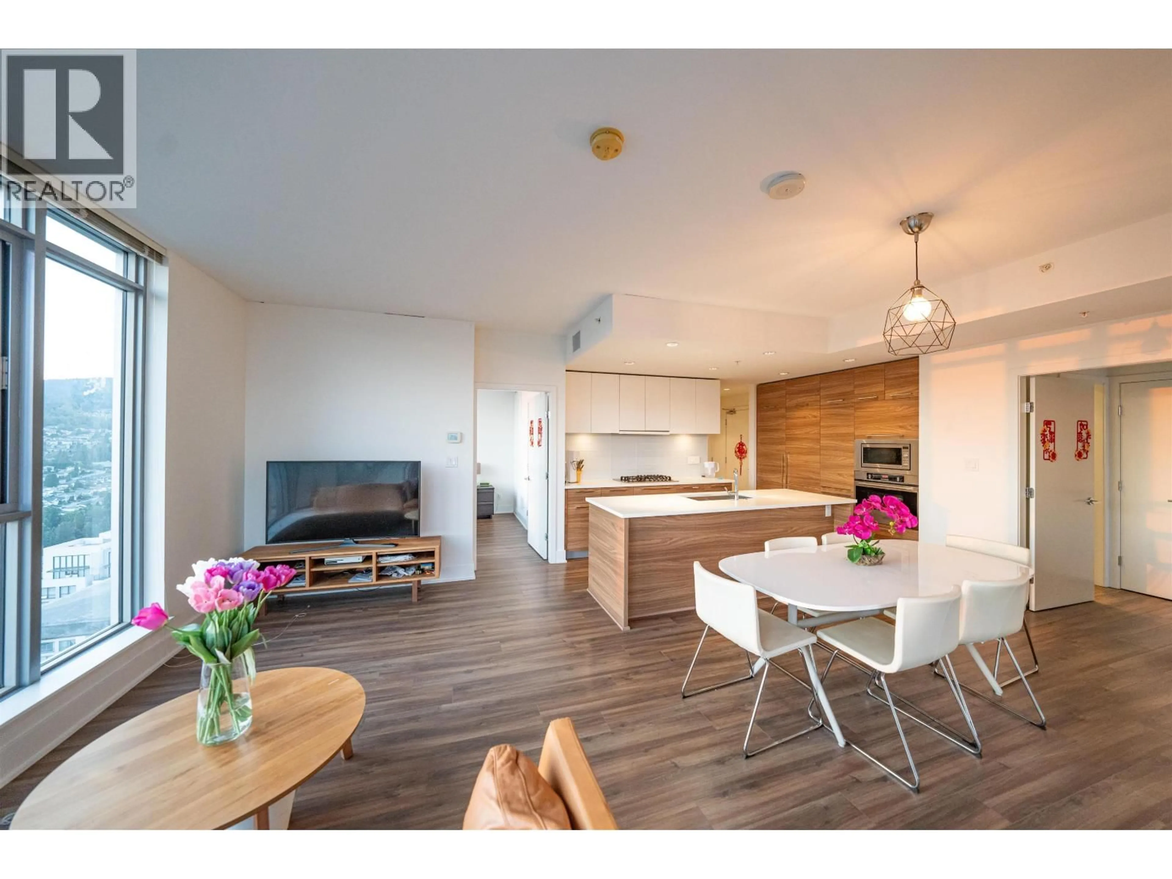 Open concept kitchen, wood/laminate floor for 4201 - 1188 PINETREE WAY, Coquitlam British Columbia V3B0K9