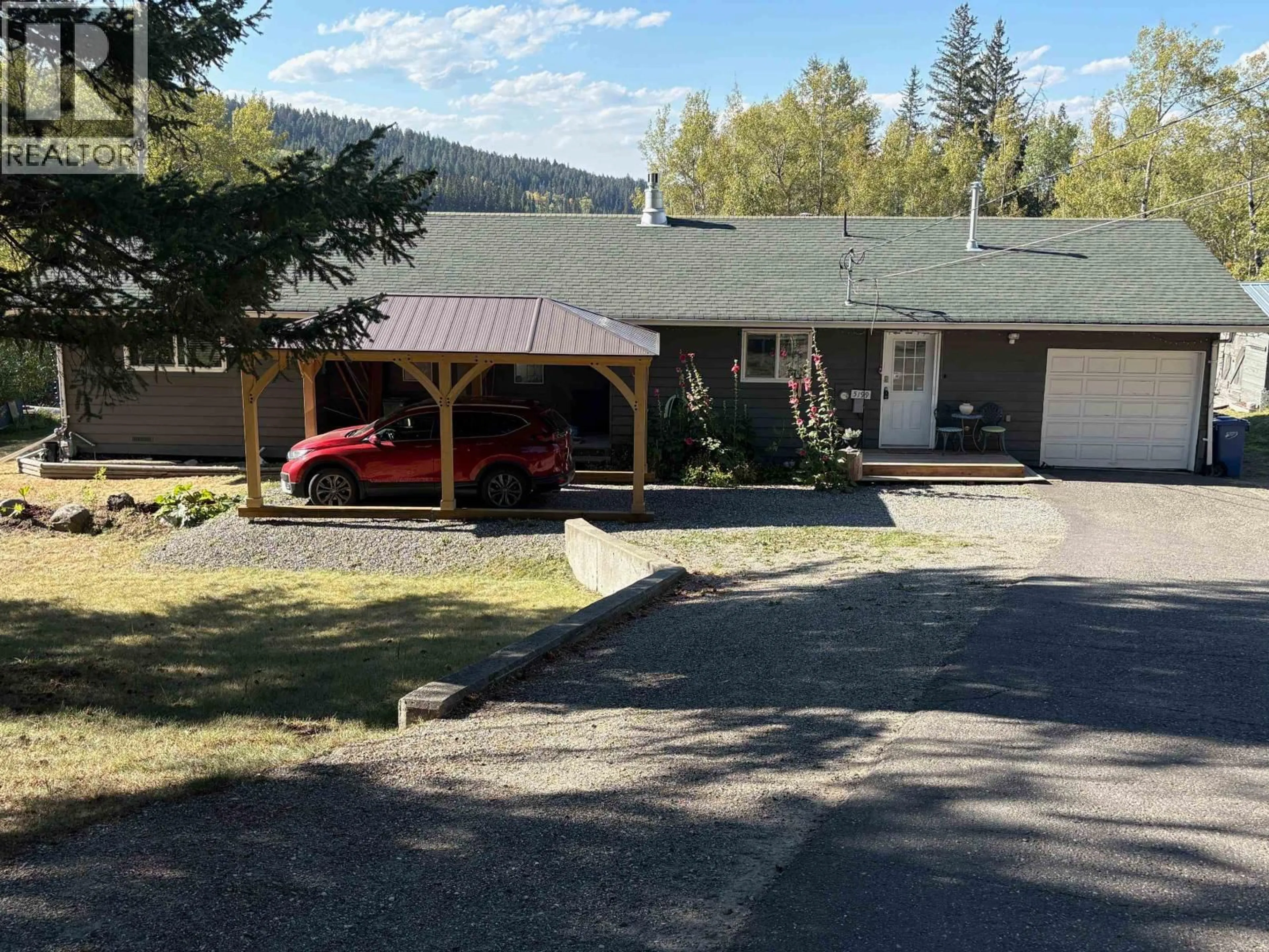 A pic from outside/outdoor area/front of a property/back of a property/a pic from drone, mountain view for 5199 KALLUM DRIVE, 108 Mile Ranch British Columbia V0K2Z0