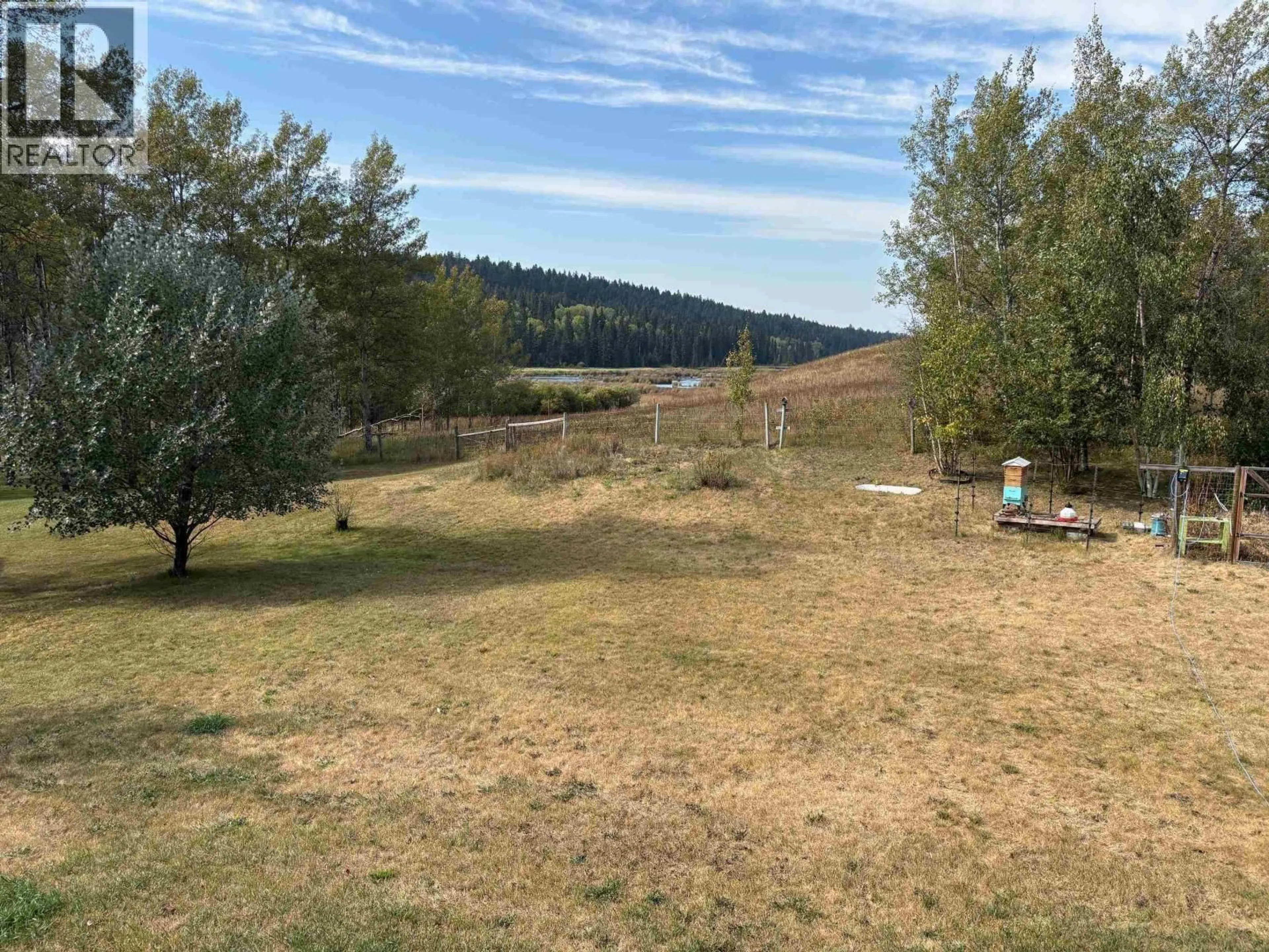 A pic from outside/outdoor area/front of a property/back of a property/a pic from drone, forest/trees view for 5199 KALLUM DRIVE, 108 Mile Ranch British Columbia V0K2Z0