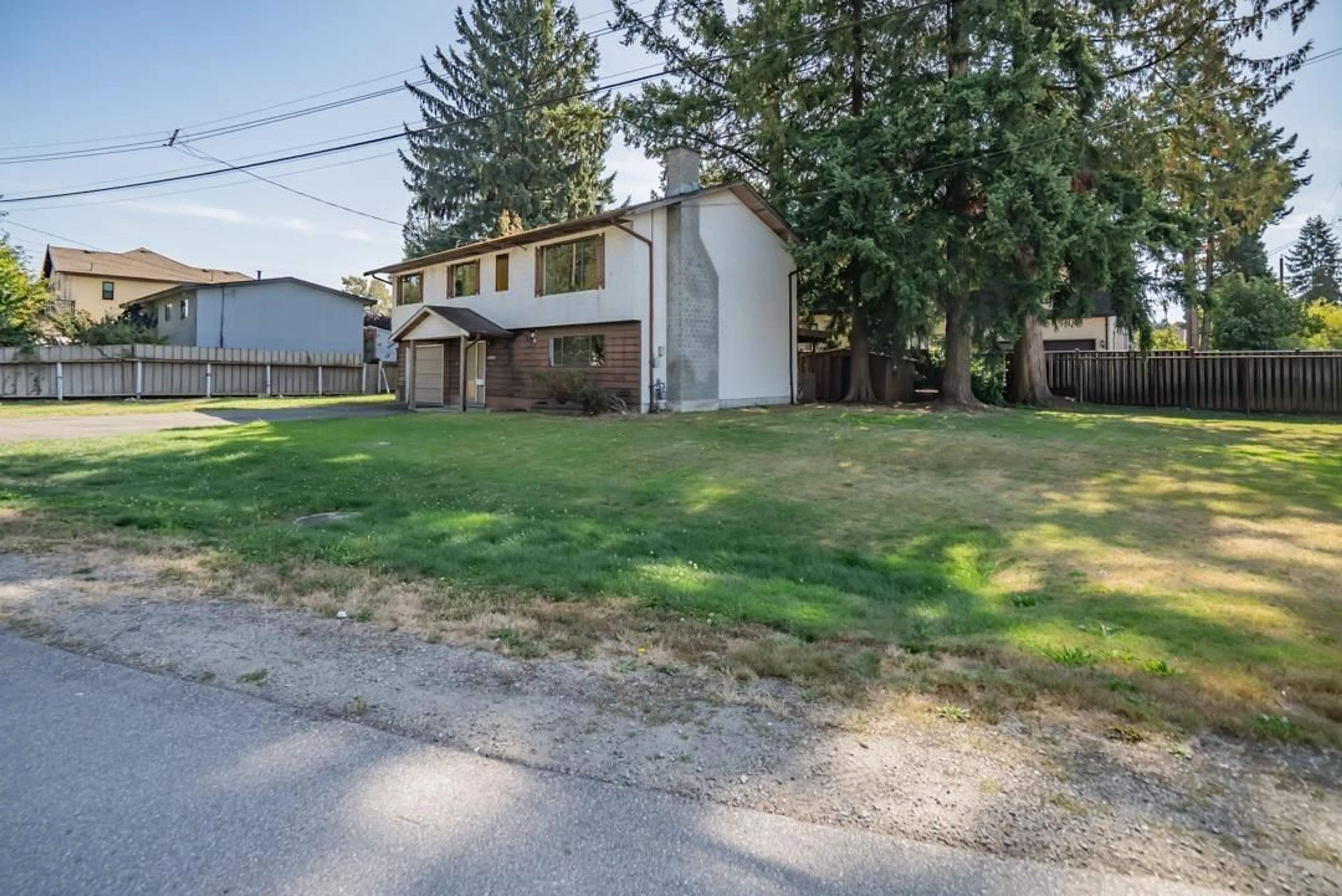 A pic from outside/outdoor area/front of a property/back of a property/a pic from drone, street for 12260 85, Surrey British Columbia V3W6G9