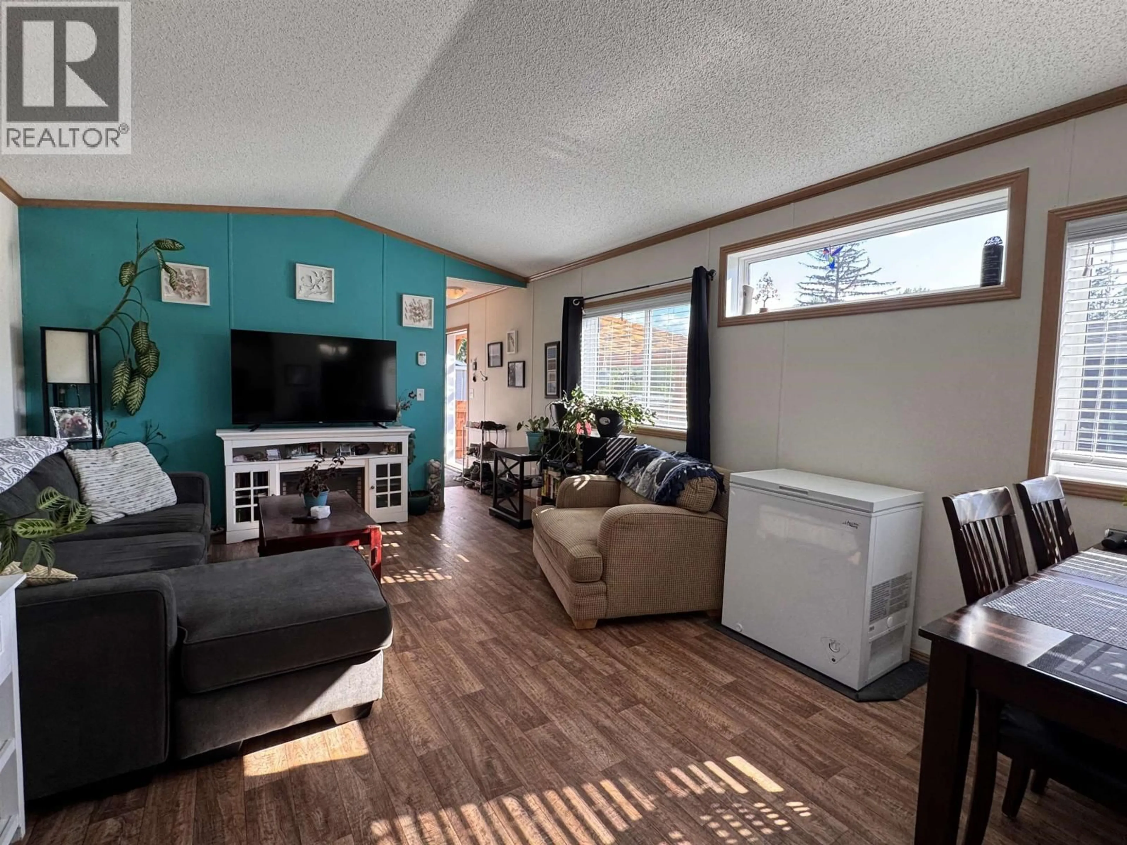 Living room with furniture, wood/laminate floor for 27 - 5204 ACKROYD STREET, Terrace British Columbia V8G1E6