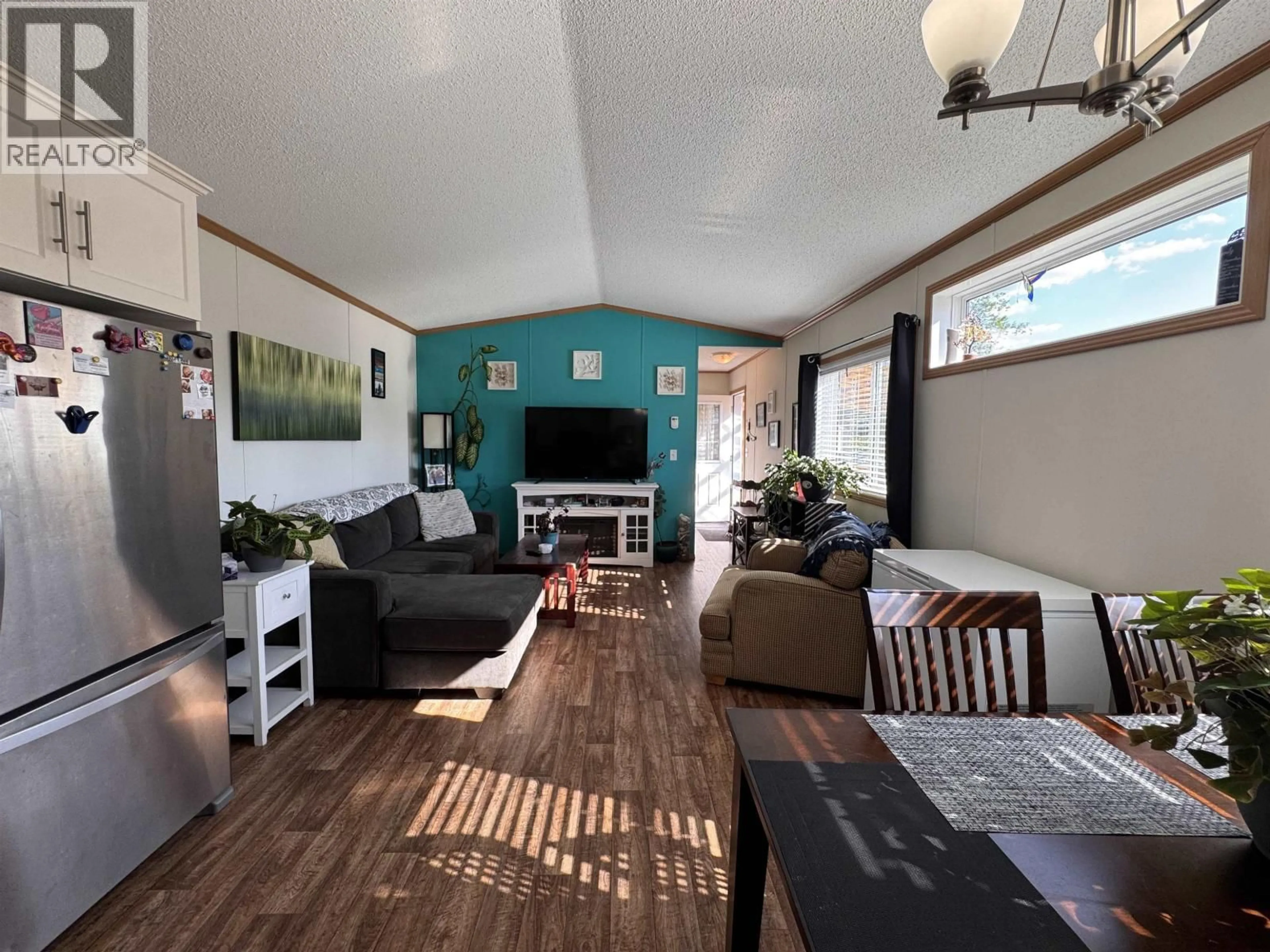 Living room with furniture, wood/laminate floor for 27 - 5204 ACKROYD STREET, Terrace British Columbia V8G1E6