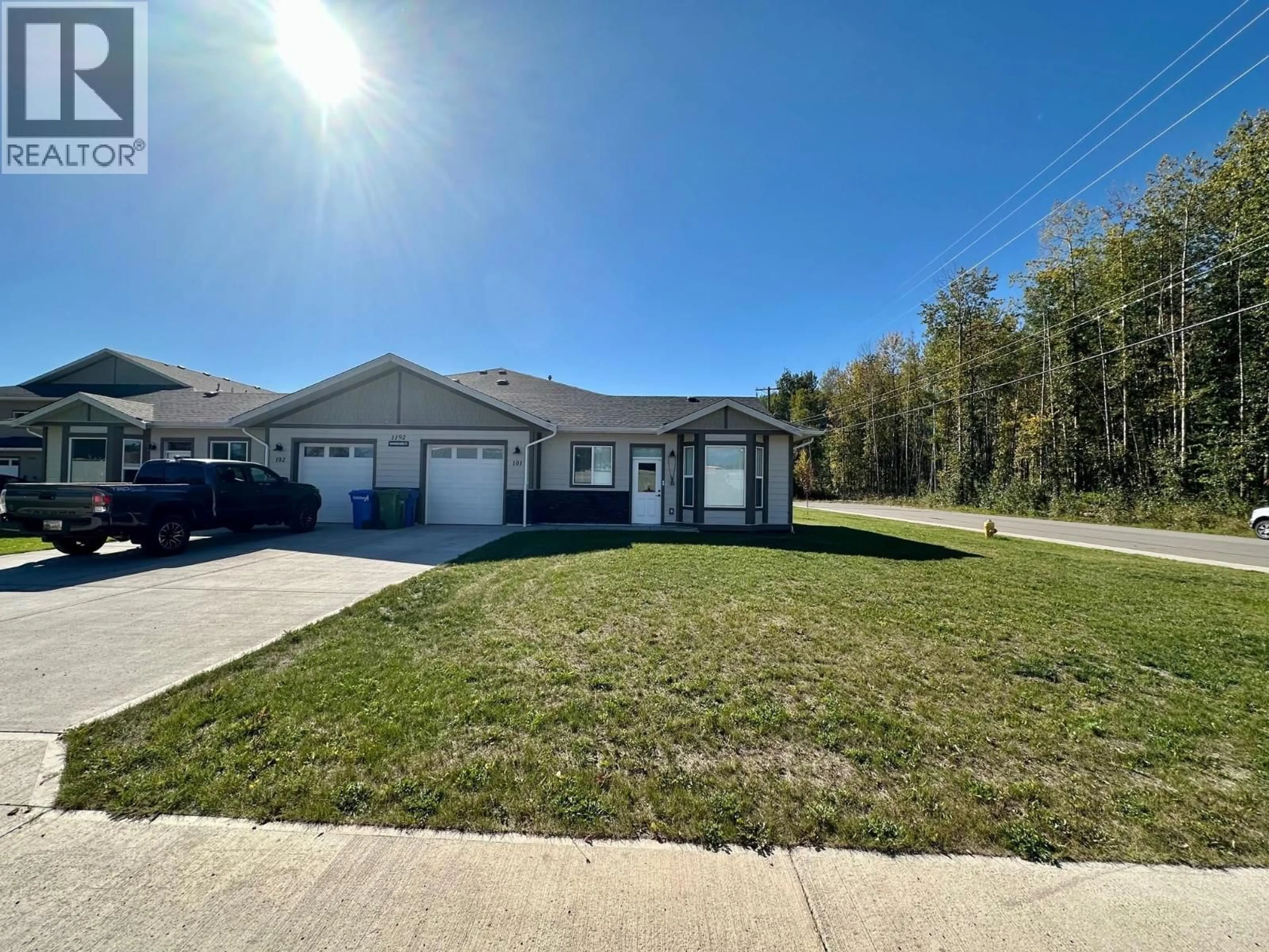 A pic from outside/outdoor area/front of a property/back of a property/a pic from drone, street for 101 - 1192 VANCOUVER STREET, Smithers British Columbia V0J2N0