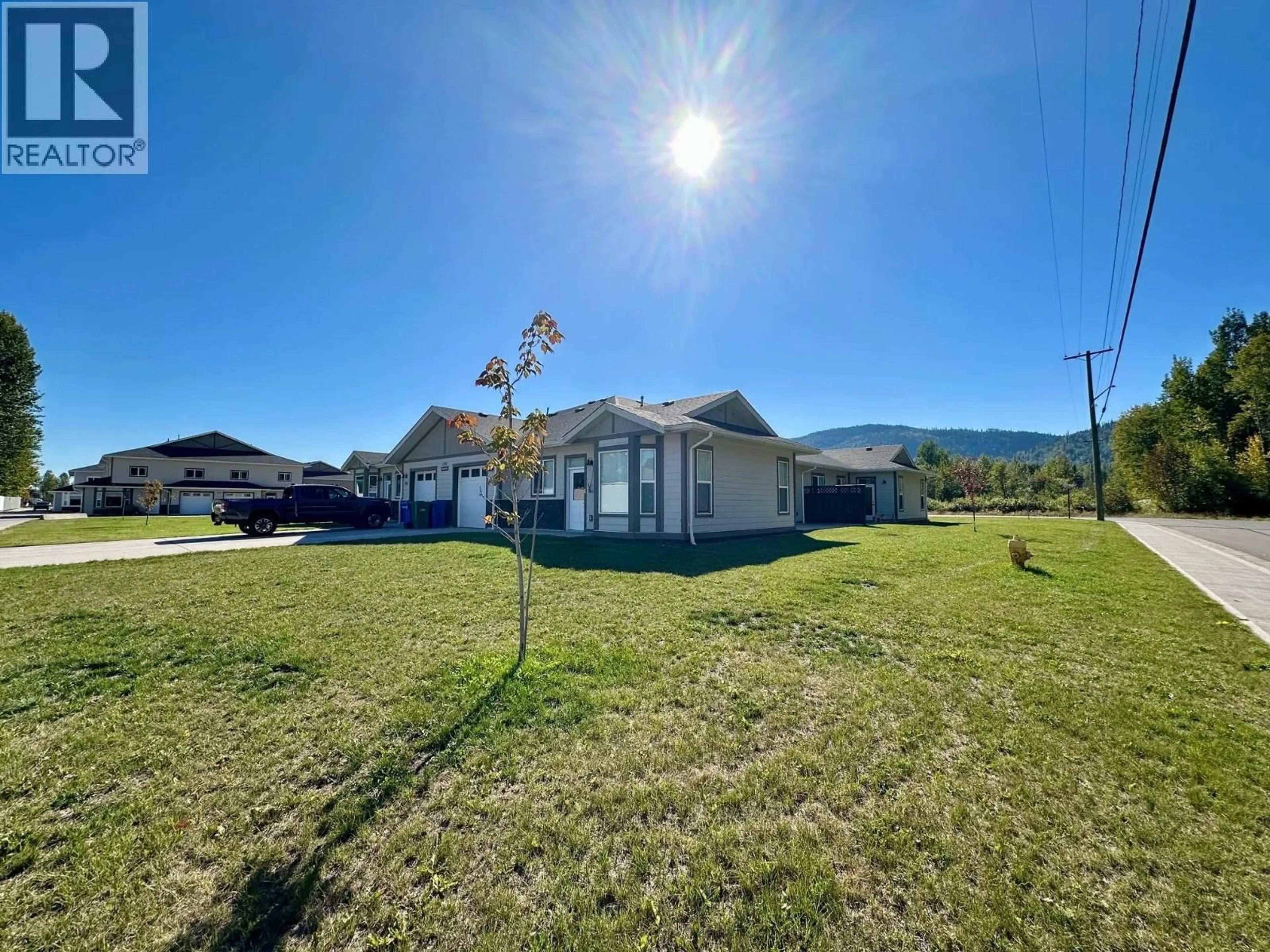 A pic from outside/outdoor area/front of a property/back of a property/a pic from drone, mountain view for 101 - 1192 VANCOUVER STREET, Smithers British Columbia V0J2N0