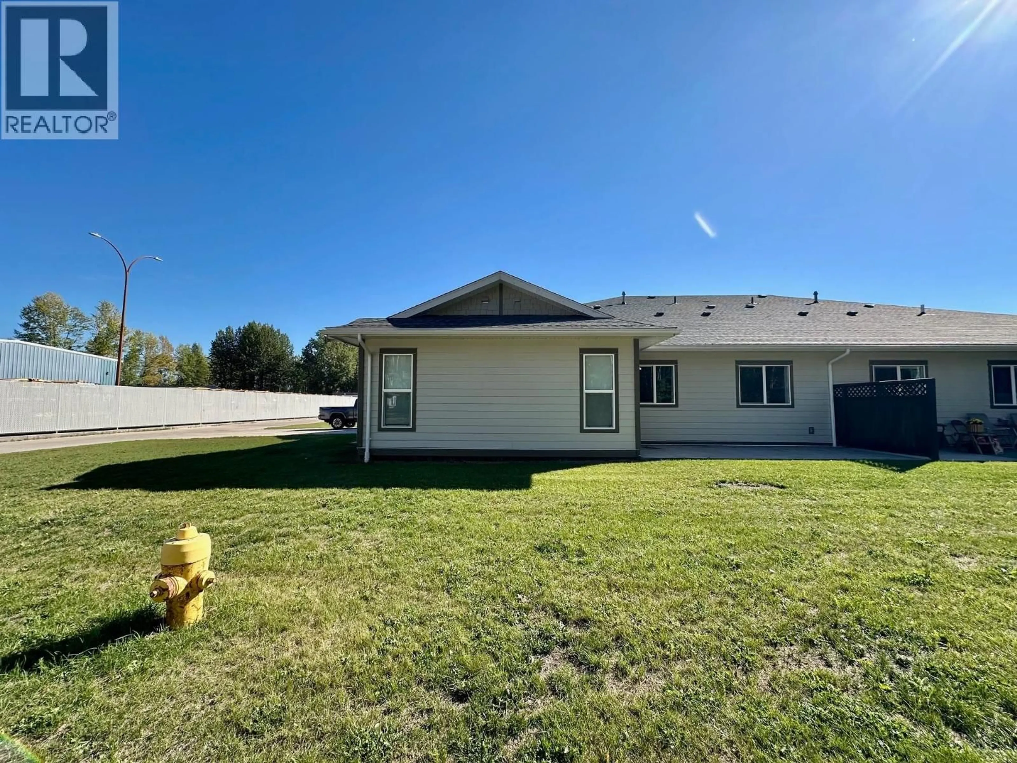 A pic from outside/outdoor area/front of a property/back of a property/a pic from drone, water/lake/river/ocean view for 101 - 1192 VANCOUVER STREET, Smithers British Columbia V0J2N0
