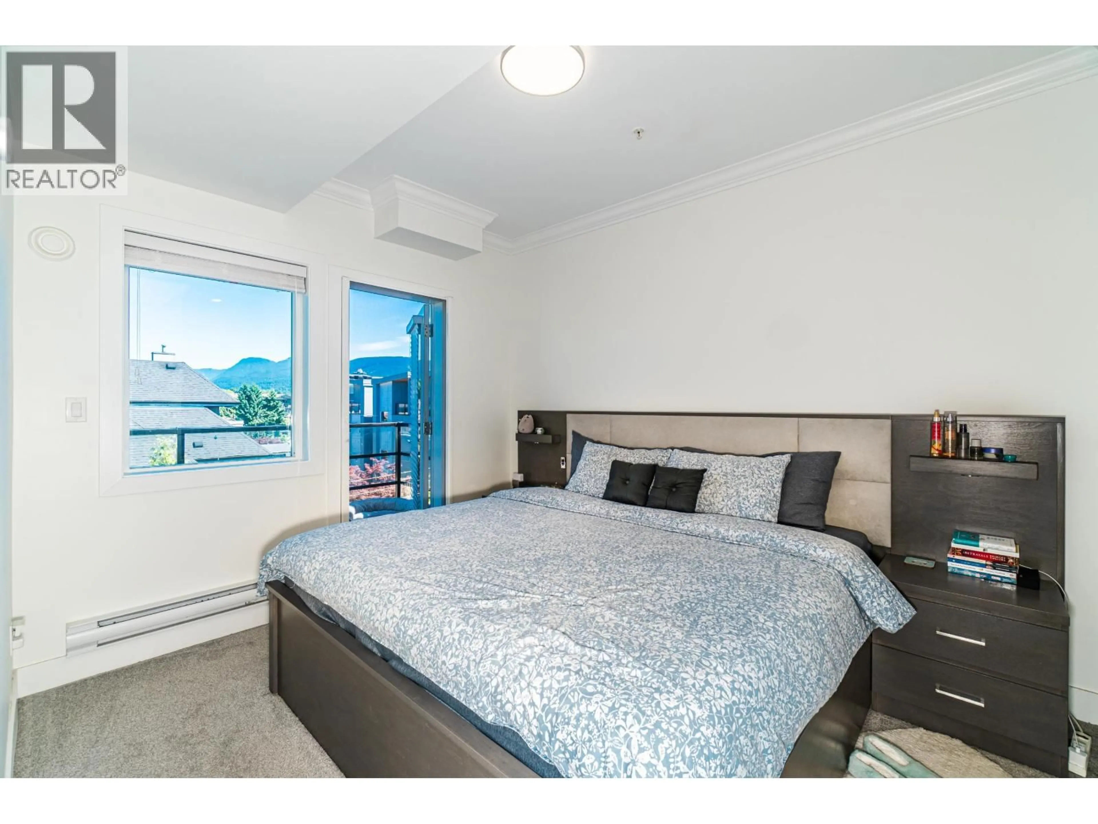 Bedroom with bed, wood/laminate floor for 404 - 2389 HAWTHORNE AVENUE, Port Coquitlam British Columbia V3C0T2