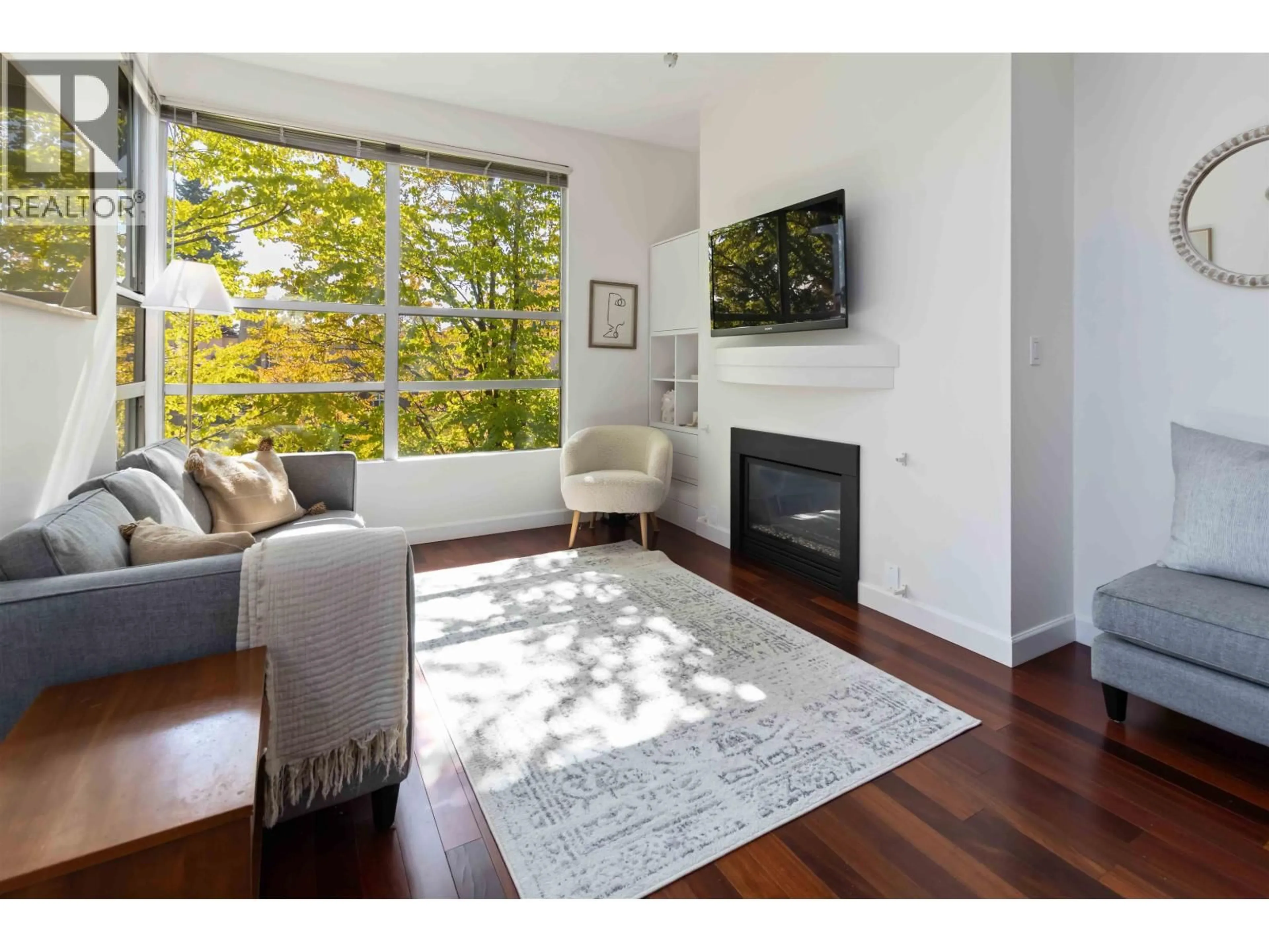 Living room with furniture, wood/laminate floor for 409 - 3083 4TH AVENUE, Vancouver British Columbia V6K1R5