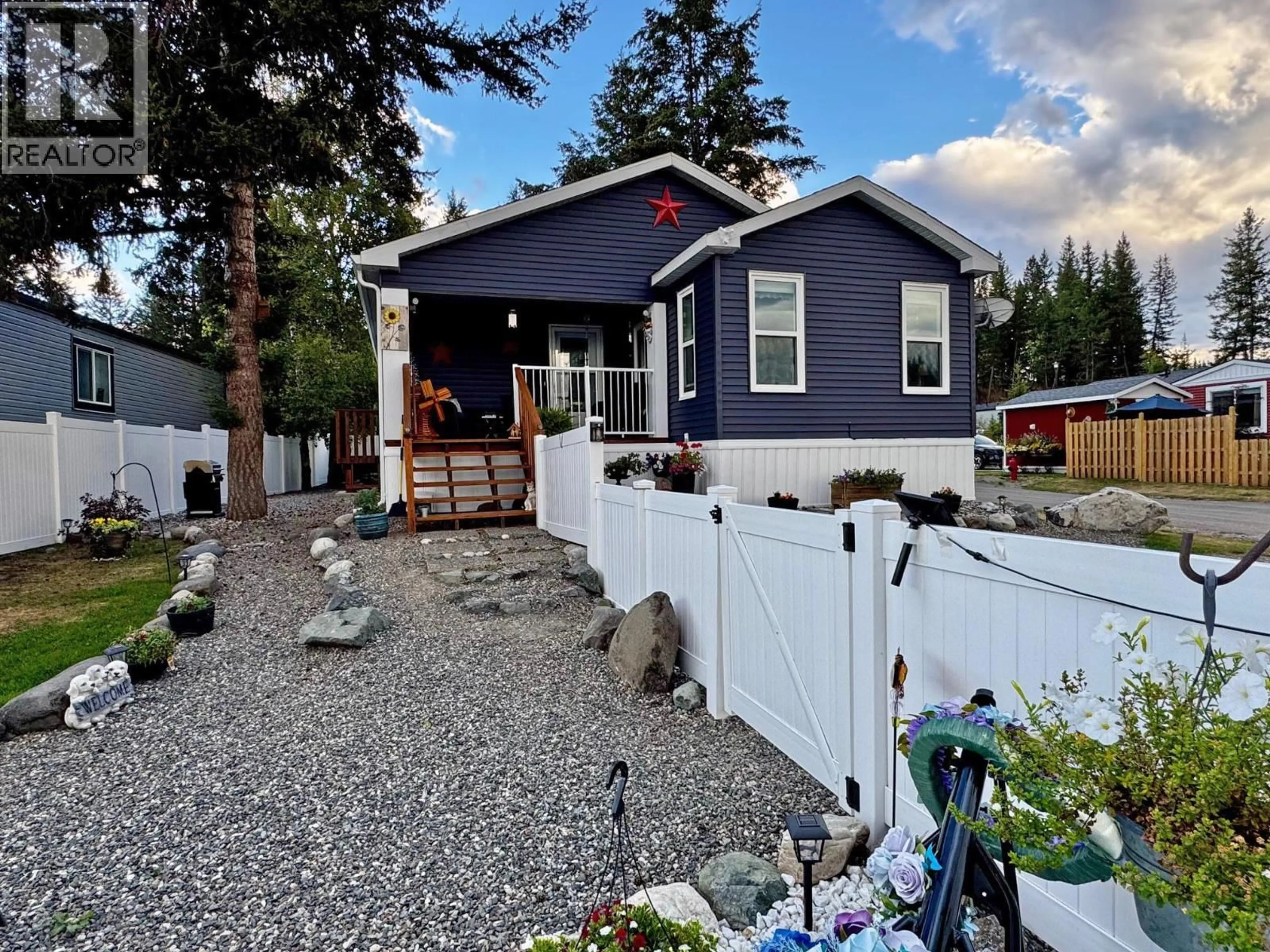 Home with vinyl exterior material, street for 31 4072 LAC LA HACHE STATION ROAD, 100 Mile House British Columbia V0K1T0