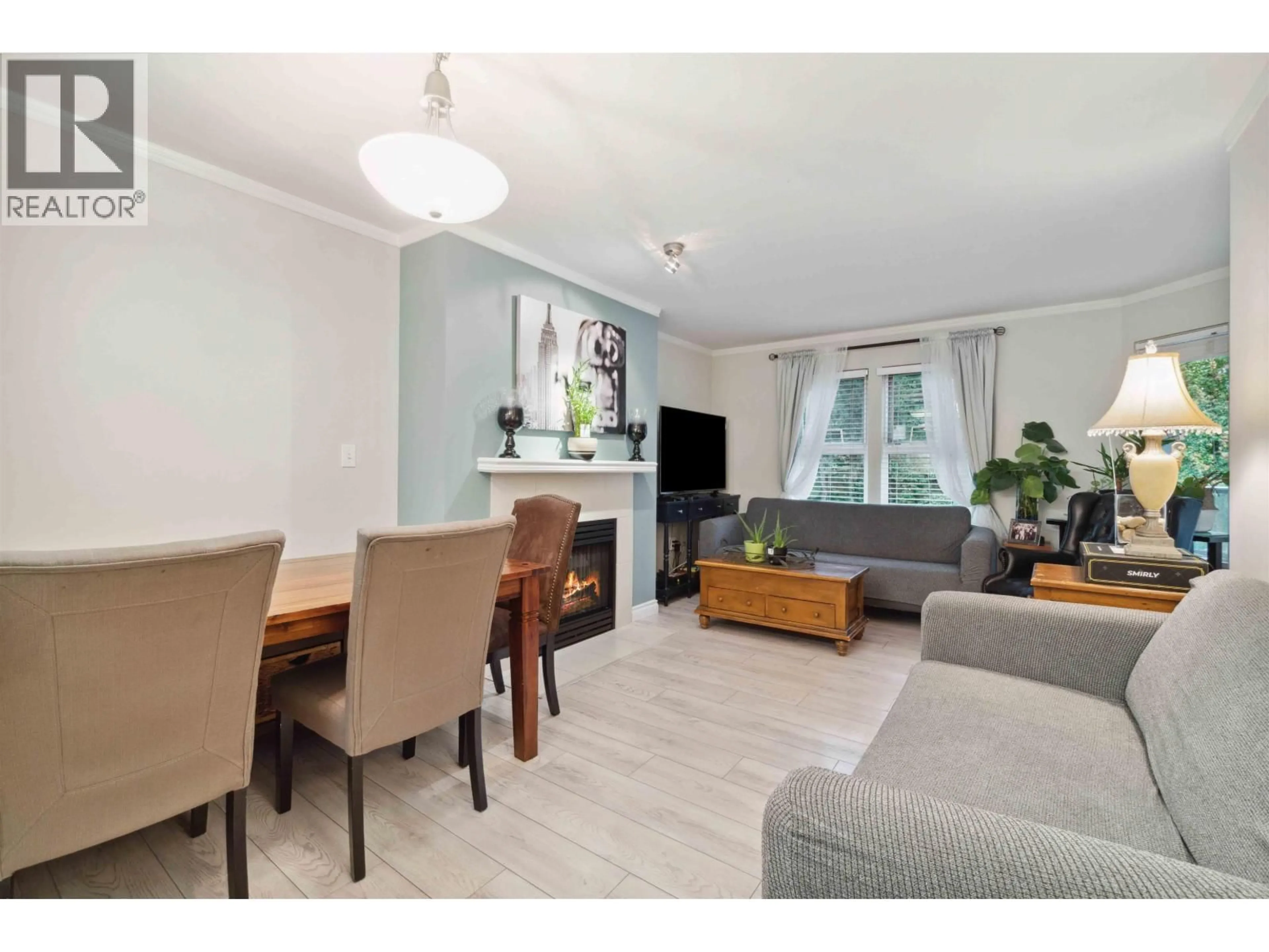 Living room with furniture, wood/laminate floor for 107 - 99 BEGIN STREET, Coquitlam British Columbia V3K6R5