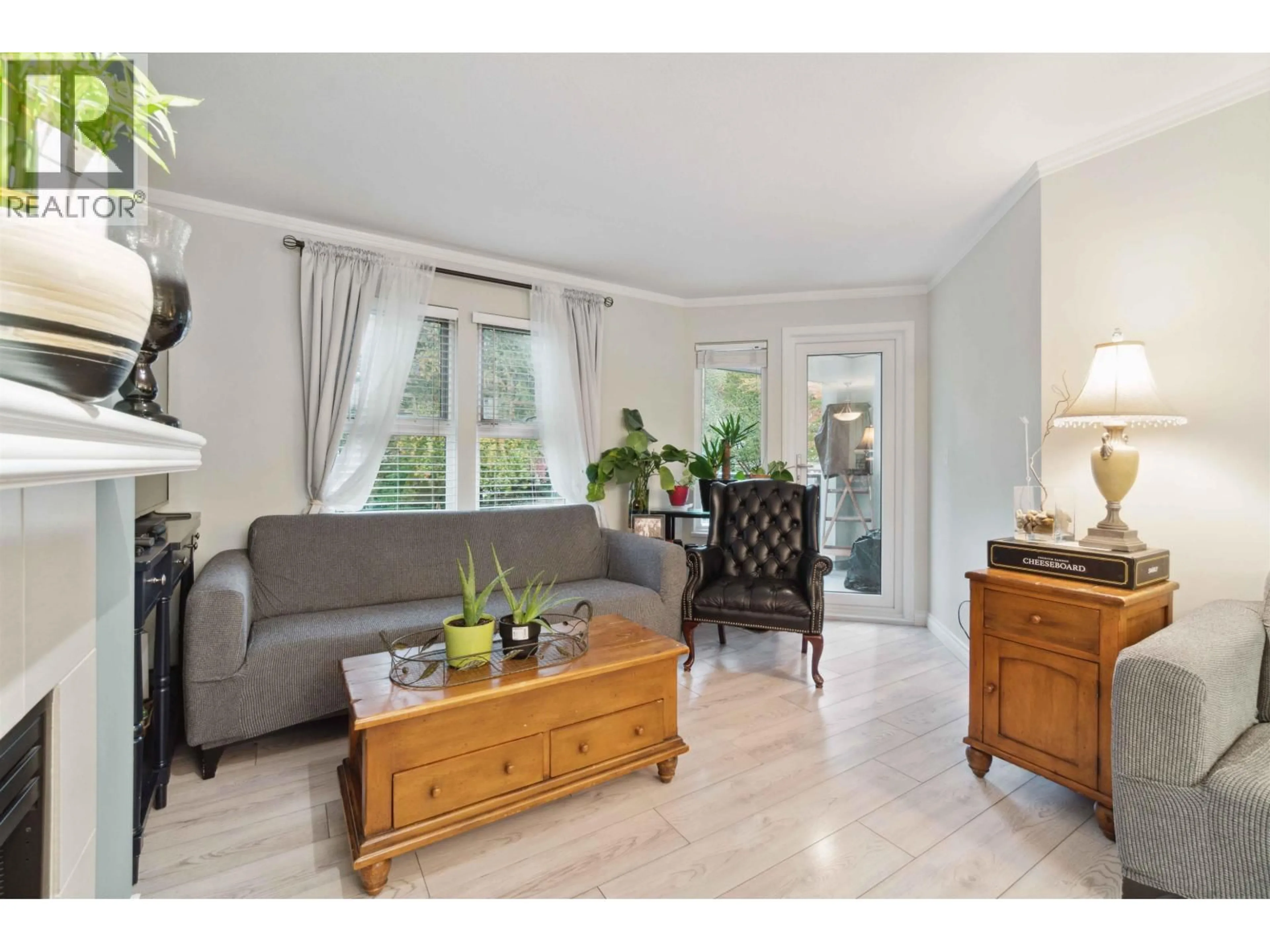 Living room with furniture, wood/laminate floor for 107 - 99 BEGIN STREET, Coquitlam British Columbia V3K6R5
