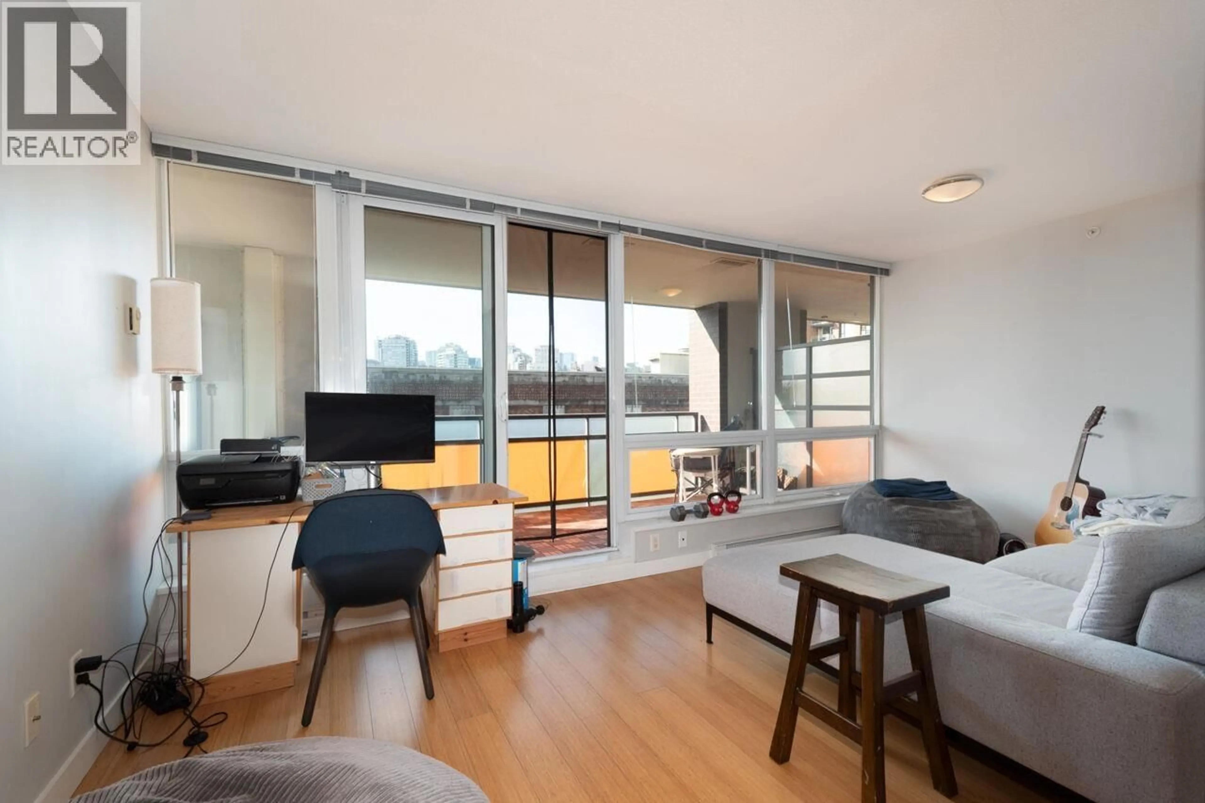 Living room with furniture, wood/laminate floor for 503 - 718 MAIN STREET, Vancouver British Columbia V6A2V7