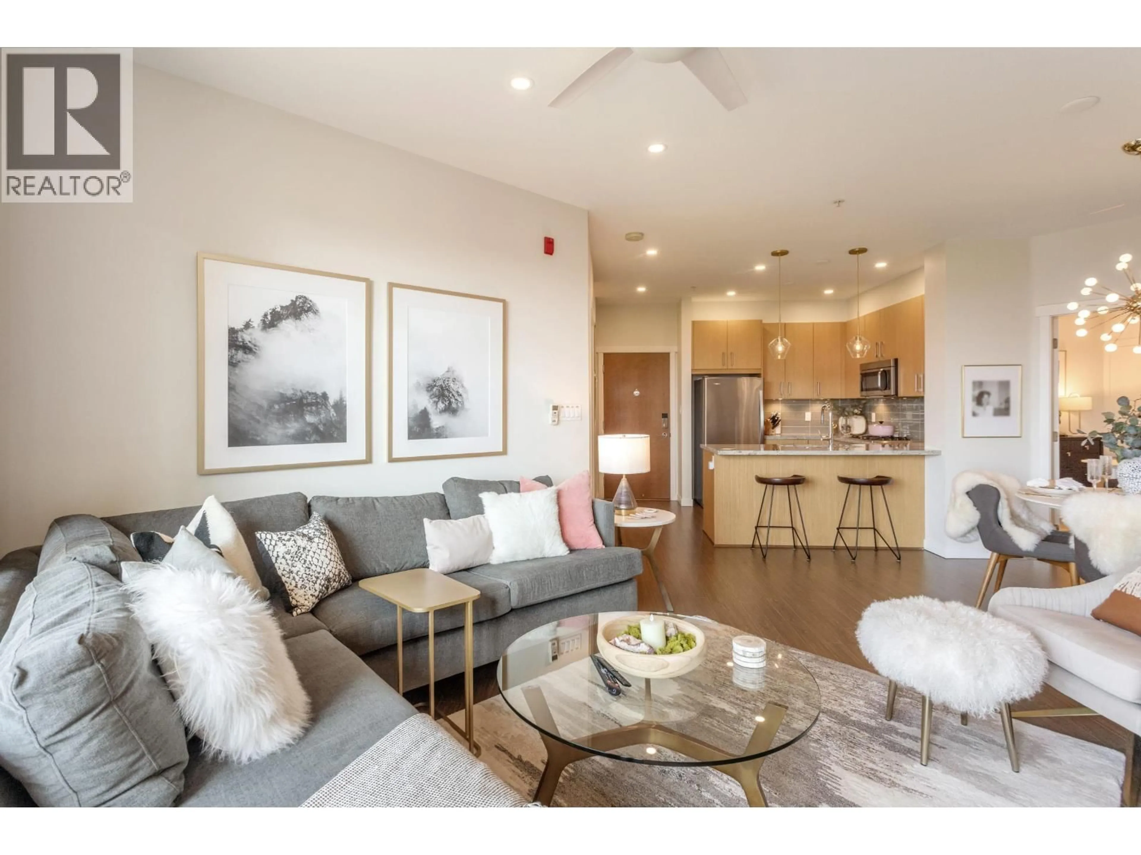 Living room with furniture, wood/laminate floor for 526 - 119 22ND STREET, North Vancouver British Columbia V7M0B4