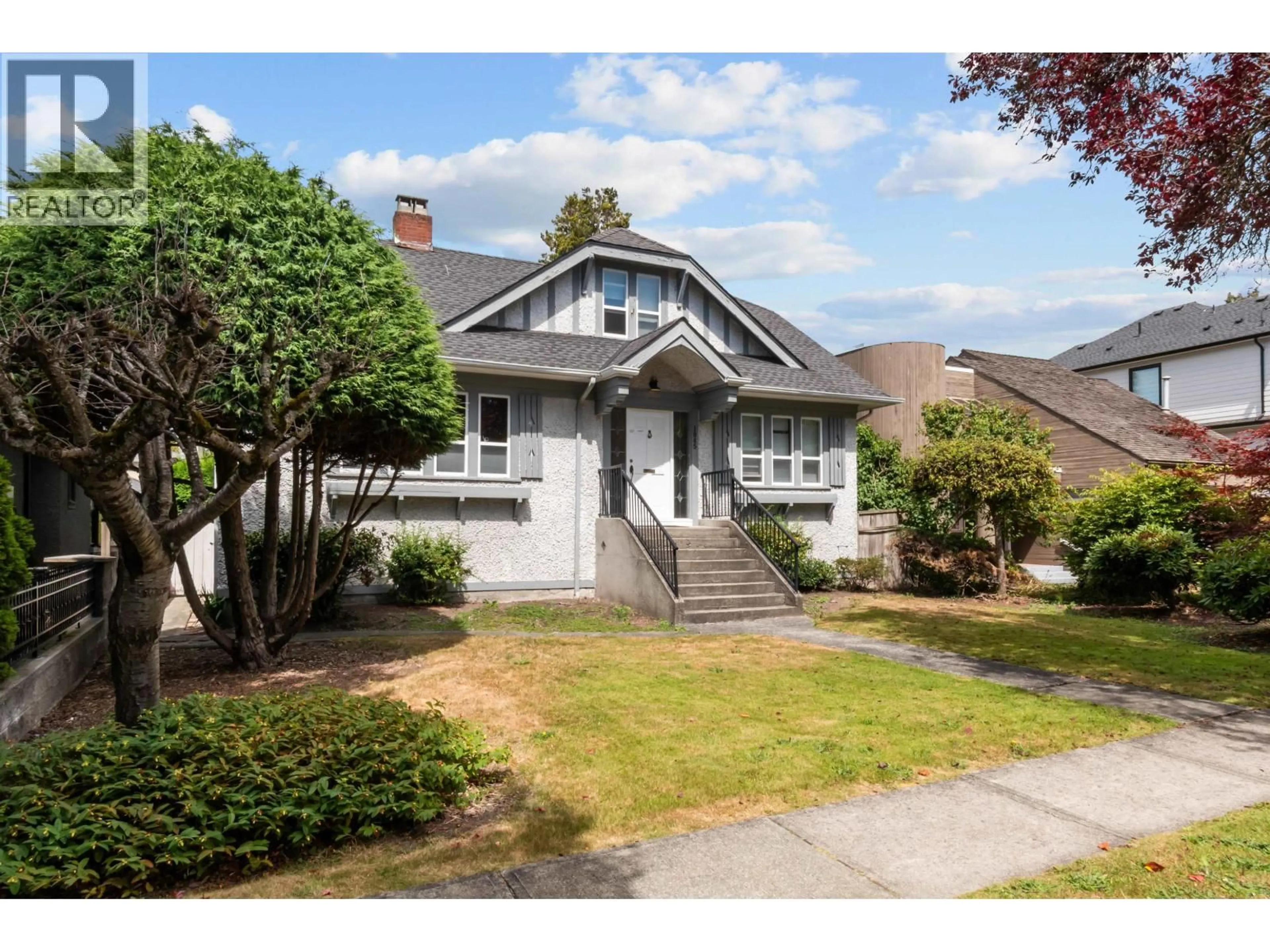 Home with vinyl exterior material, street for 1945 45TH AVENUE, Vancouver British Columbia V6M2H7