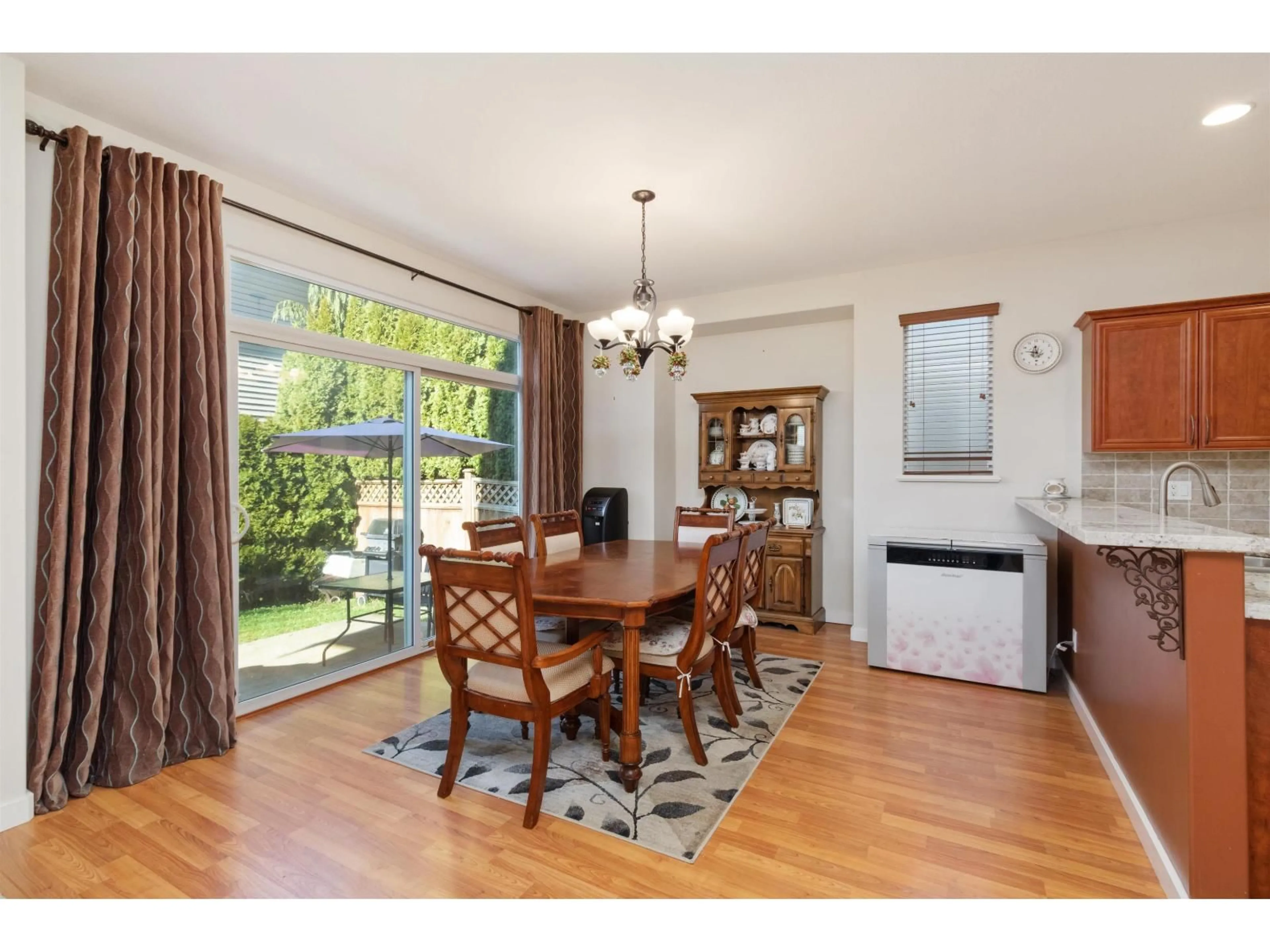 Dining room, wood/laminate floor for 8421 209, Langley British Columbia V2Y0A3