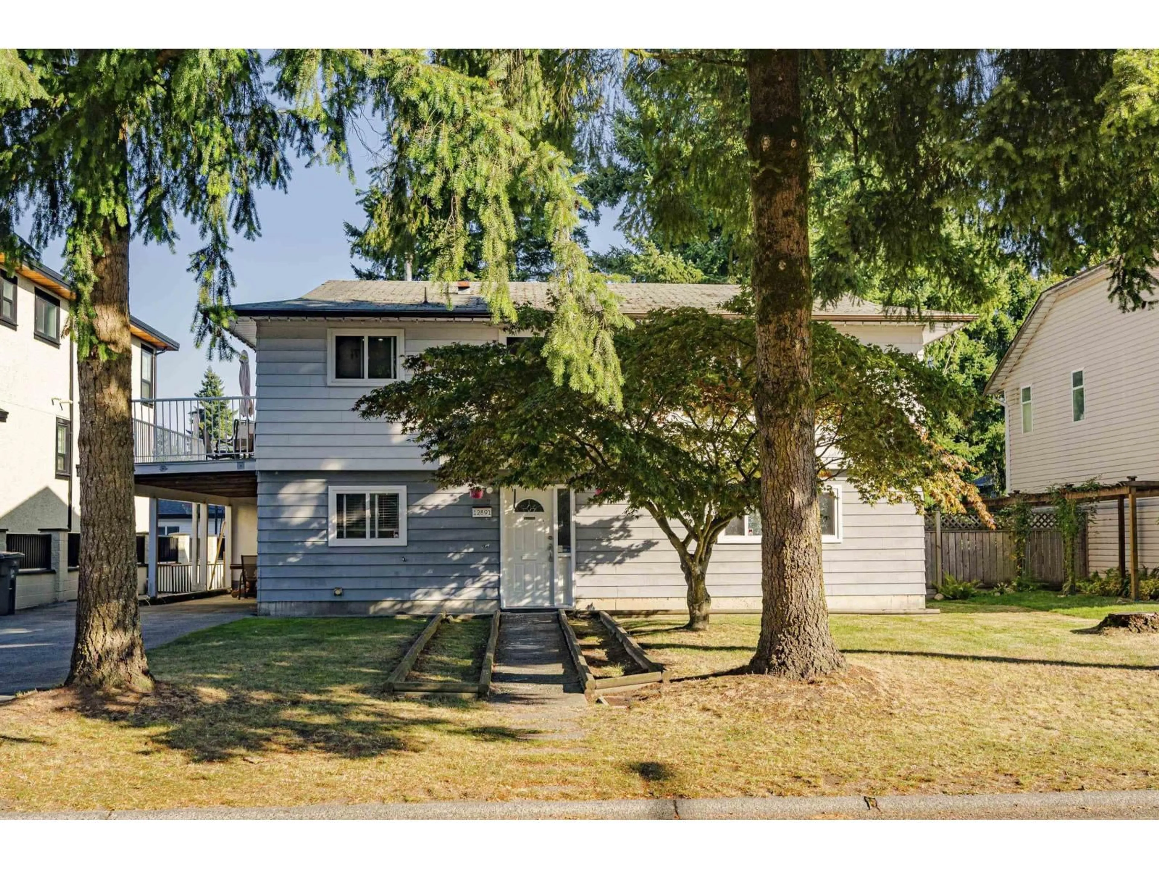 Home with vinyl exterior material, street for 12891 69, Surrey British Columbia V3W6W3