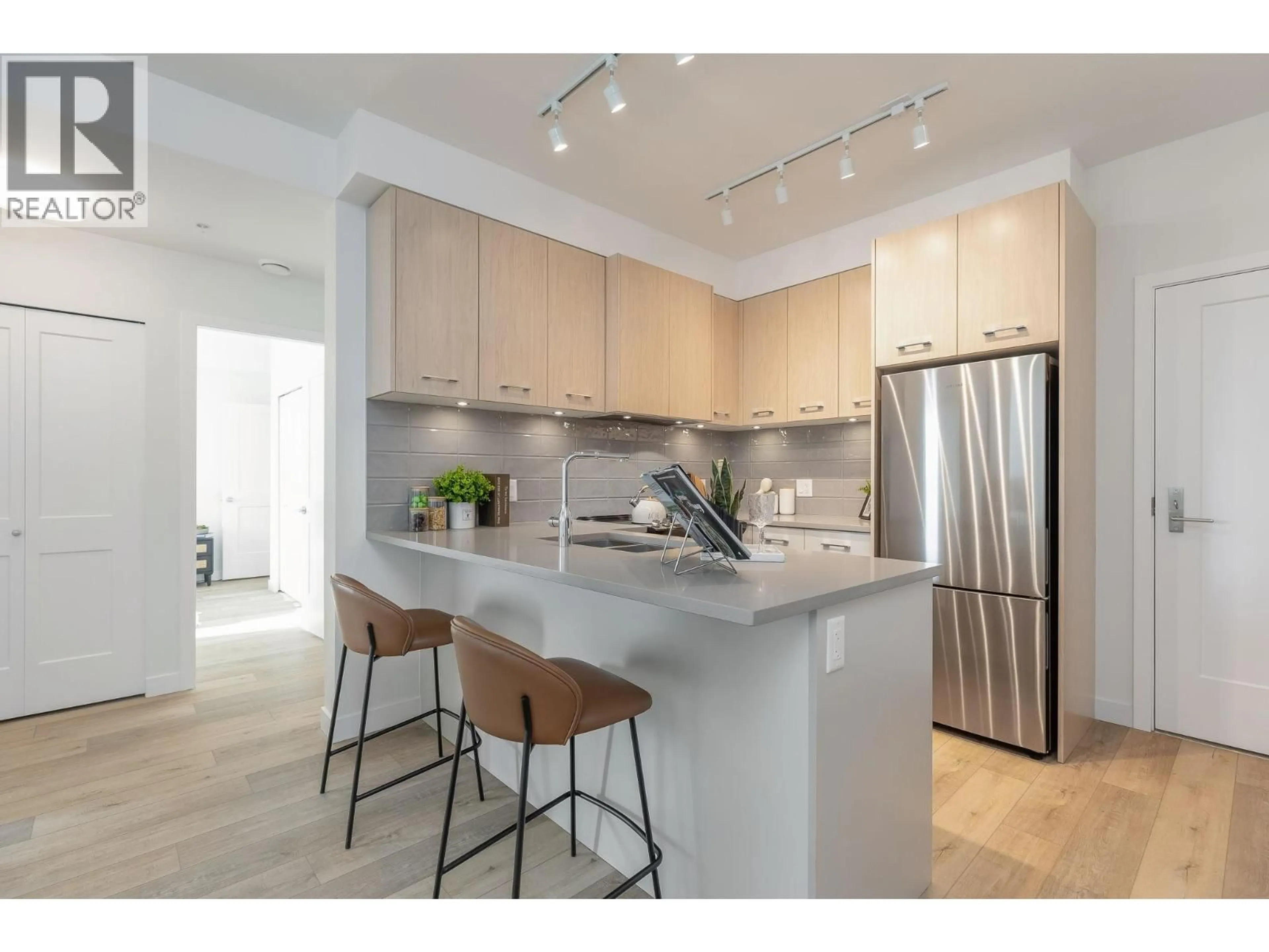Open concept kitchen, unknown for 203 - 4933 CLARENDON STREET, Vancouver British Columbia V5R0J6
