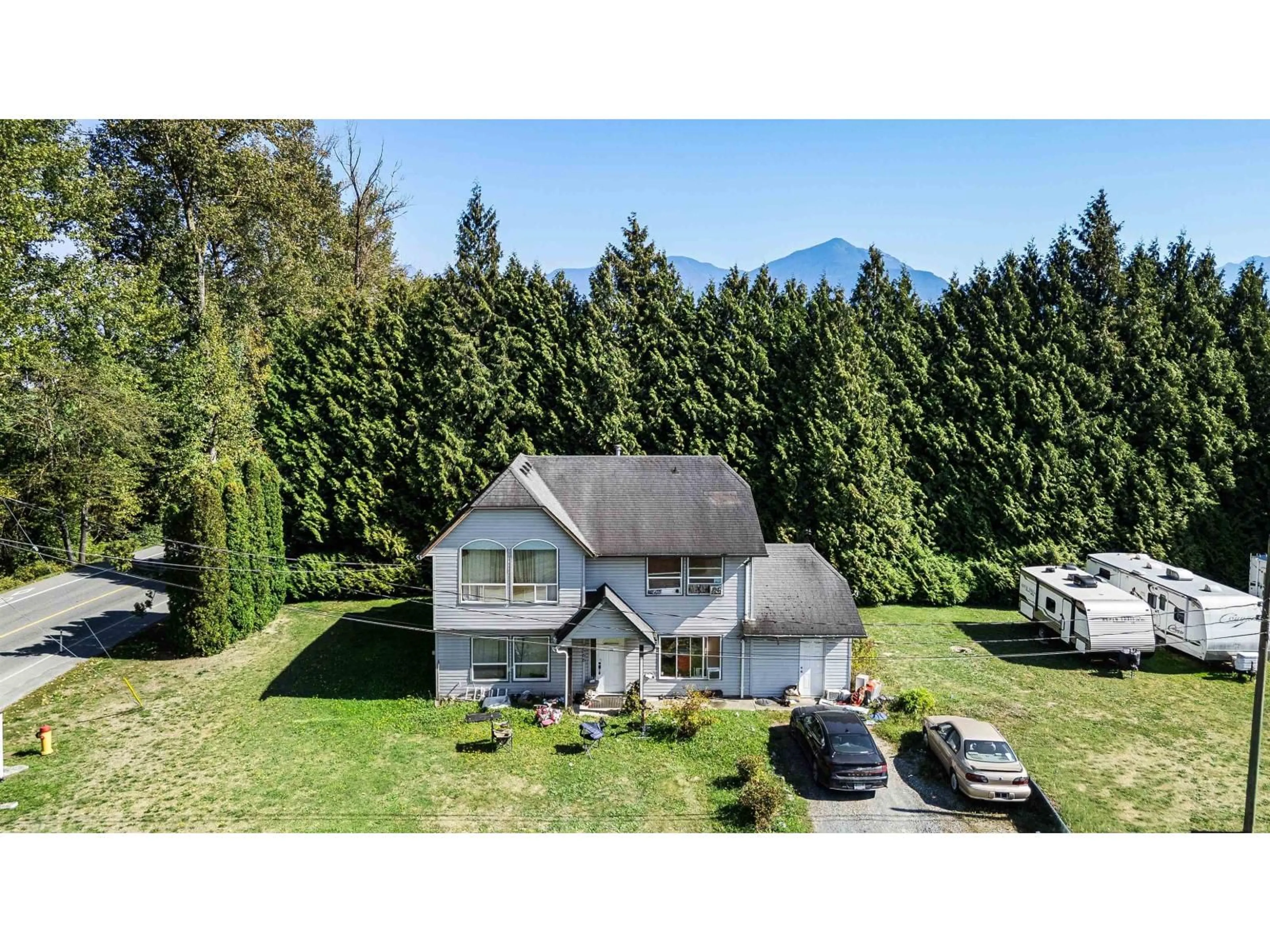 A pic from outside/outdoor area/front of a property/back of a property/a pic from drone, mountain view for 7566 CHILLIWACK RIVER ROAD, Chilliwack British Columbia V2R4L9