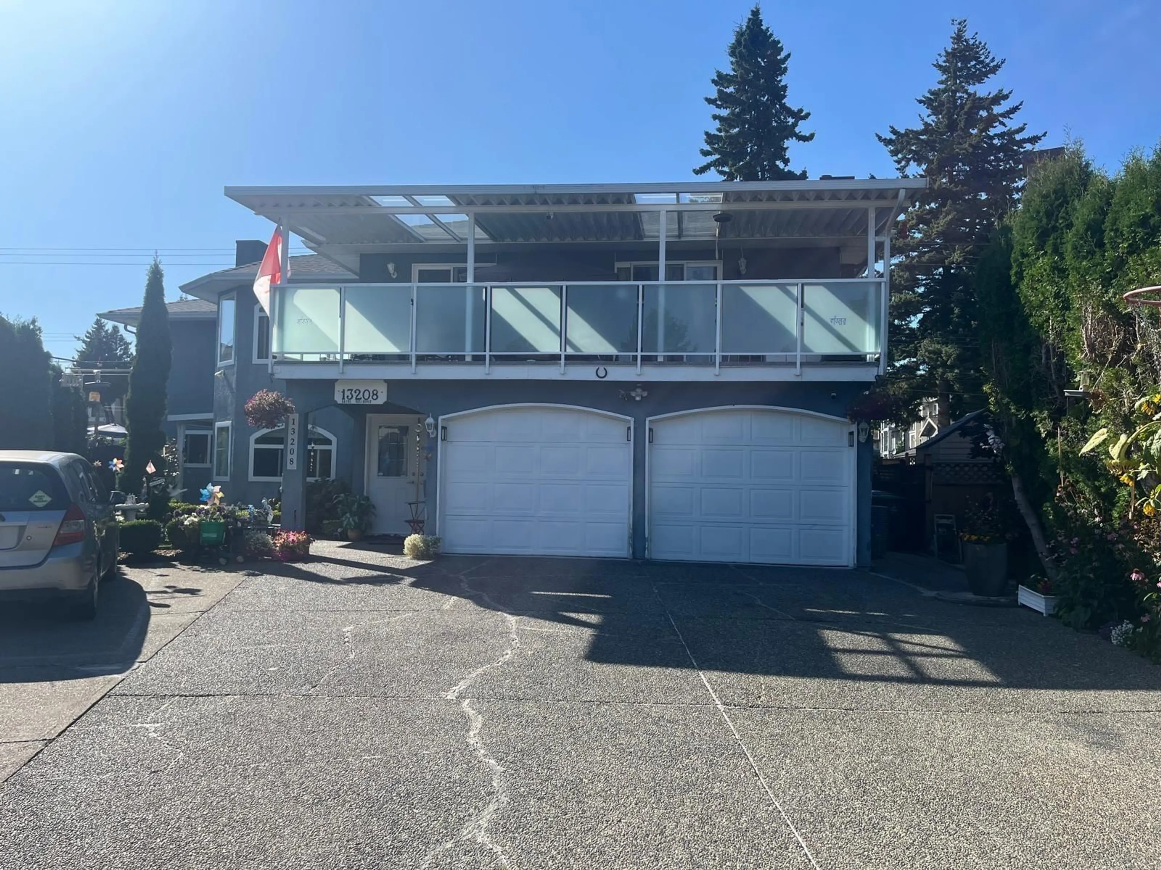 A pic from outside/outdoor area/front of a property/back of a property/a pic from drone, street for 13208 66A, Surrey British Columbia V3W8E3