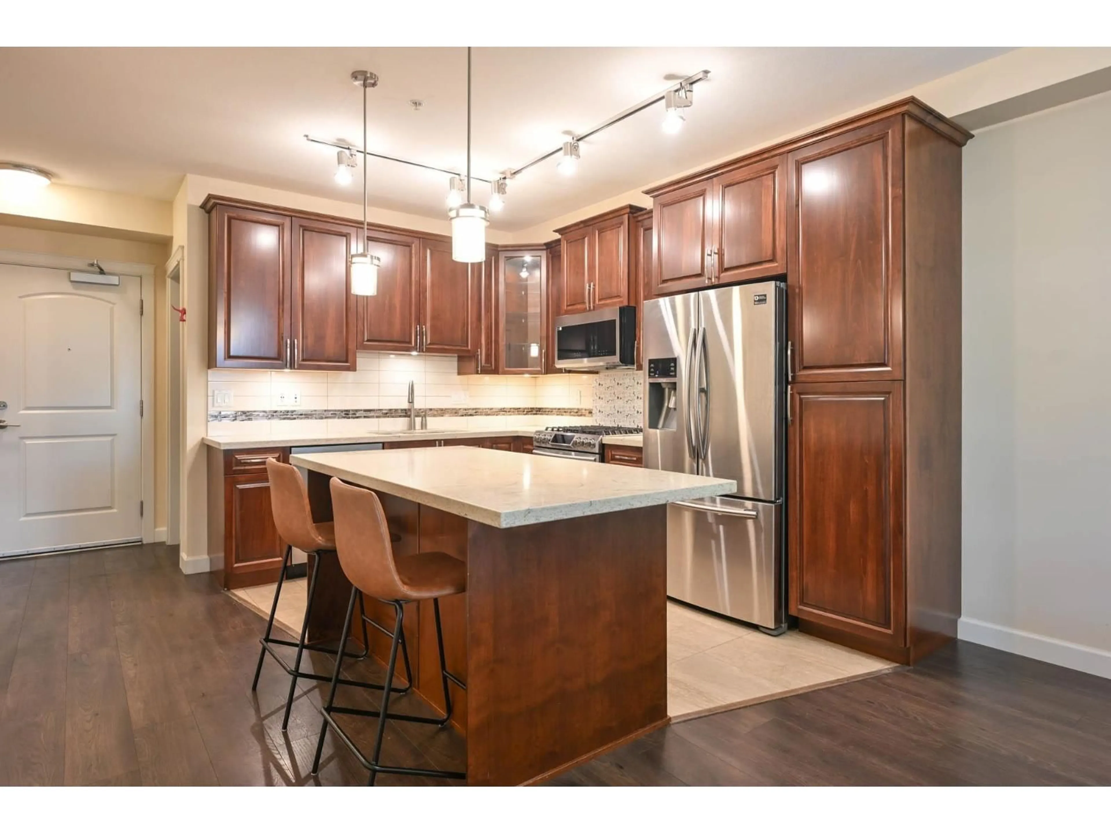 Open concept kitchen, wood/laminate floor for B222 - 20716 WILLOUGHBY TOWN CENTER, Langley British Columbia V2Y3J8