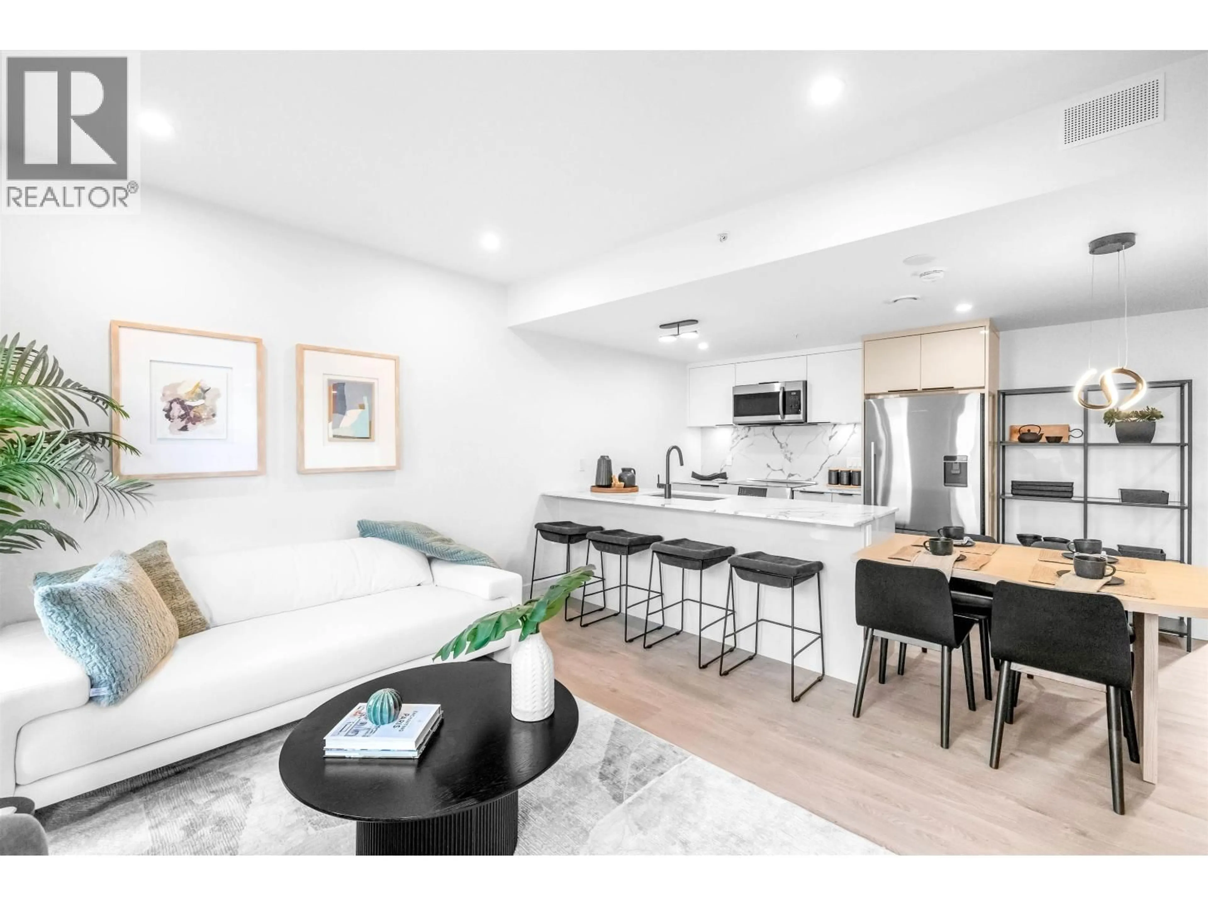 Open concept kitchen, wood/laminate floor for 2071 1ST AVENUE, Vancouver British Columbia V5N1B6