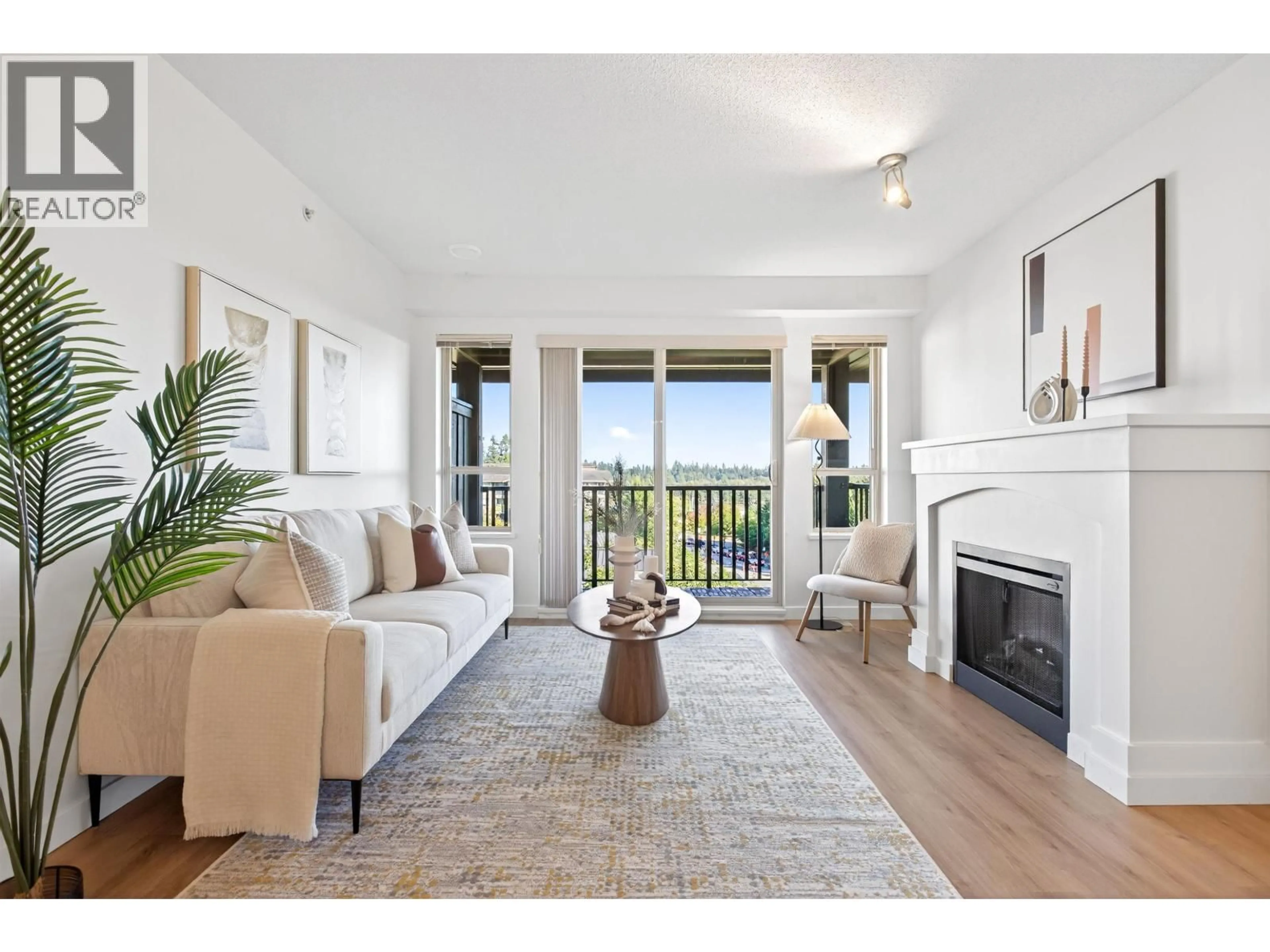 Living room with furniture, wood/laminate floor for 411 - 3110 DAYANEE SPRINGS BOULEVARD, Coquitlam British Columbia V3E0B4