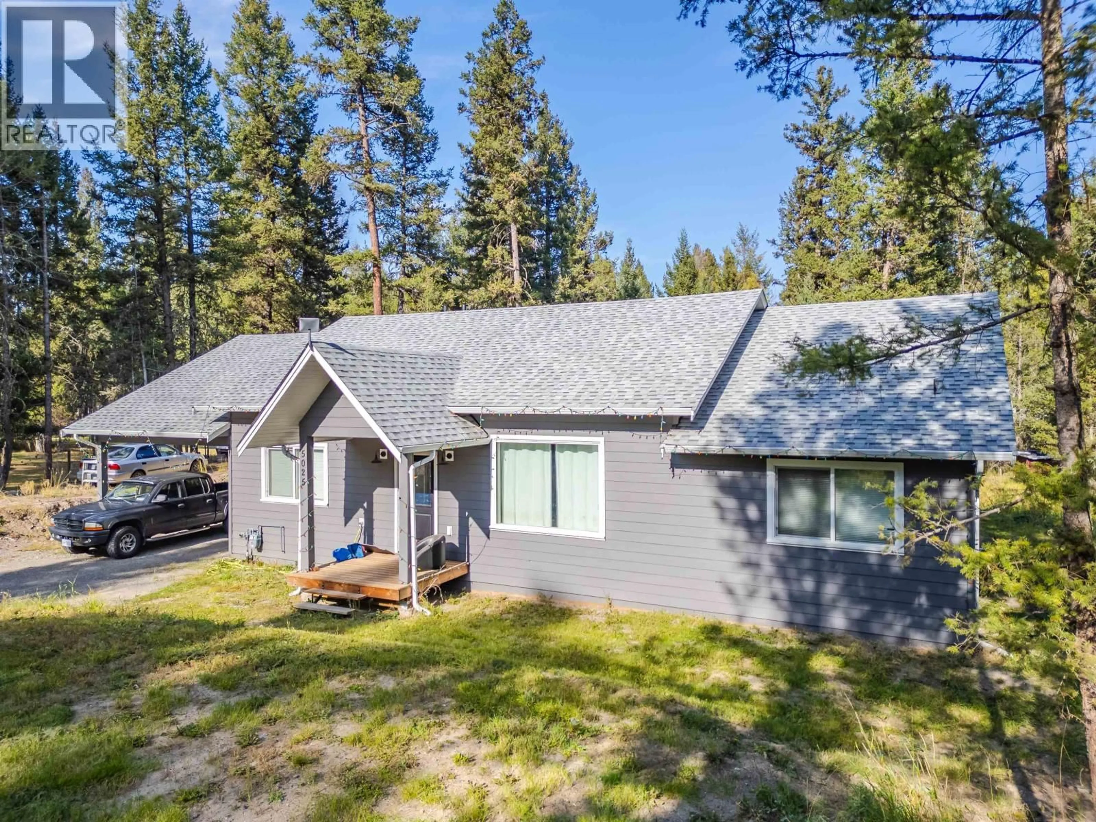 A pic from outside/outdoor area/front of a property/back of a property/a pic from drone, forest/trees view for 5025 KYLLO ROAD, 108 Mile Ranch British Columbia V0K2Z0
