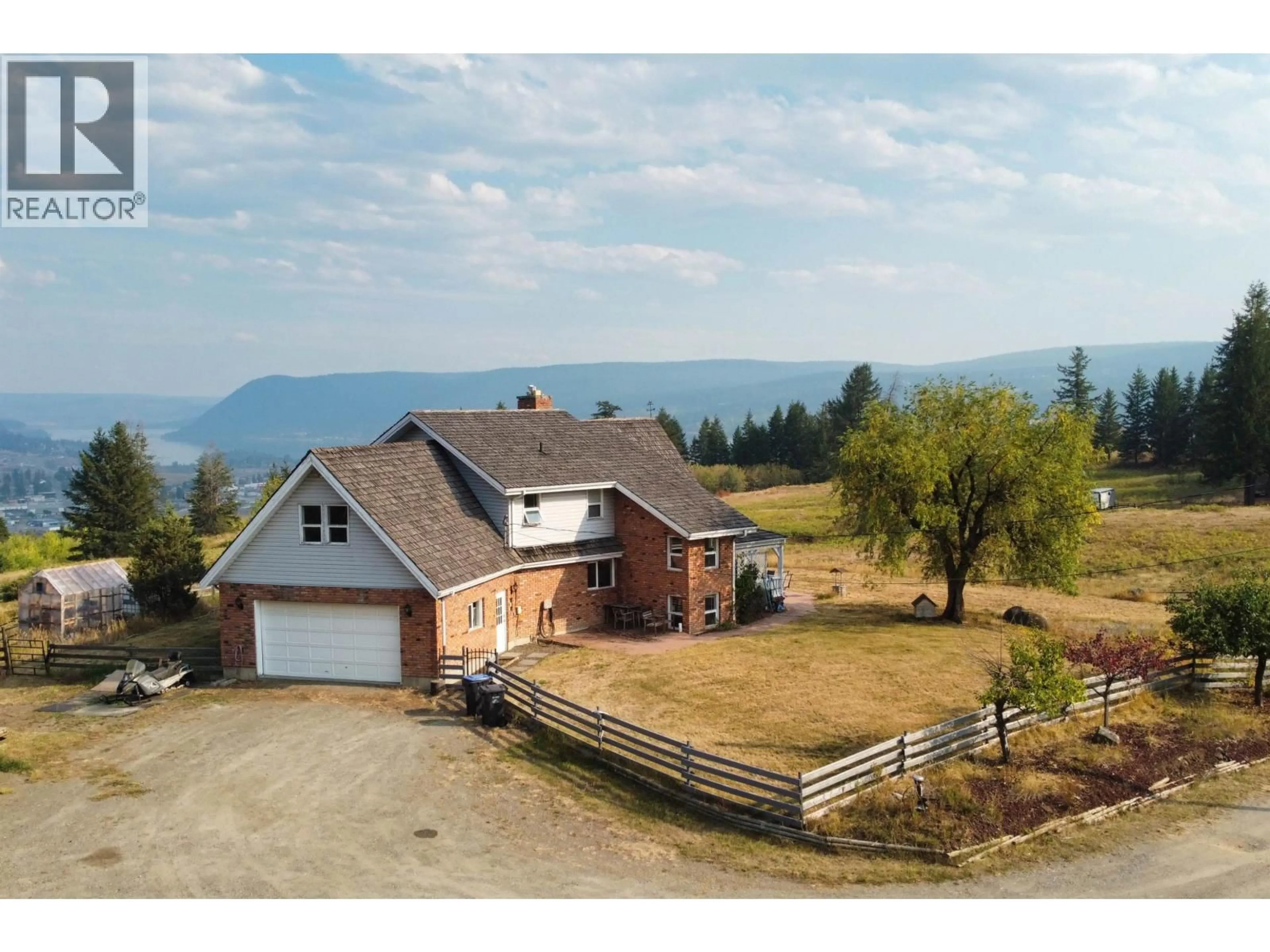 A pic from outside/outdoor area/front of a property/back of a property/a pic from drone, mountain view for 400 WOODLAND DRIVE, Williams Lake British Columbia V2G4P9