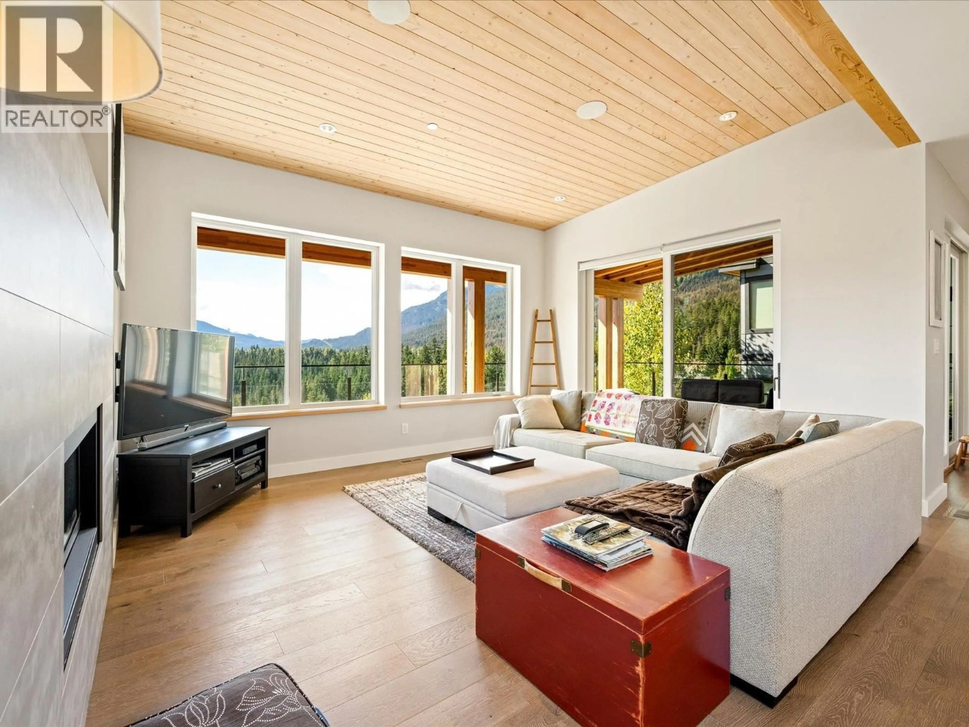 Living room with furniture, wood/laminate floor for 8409 BIG SKY TERRACE, Whistler British Columbia V8E0G8