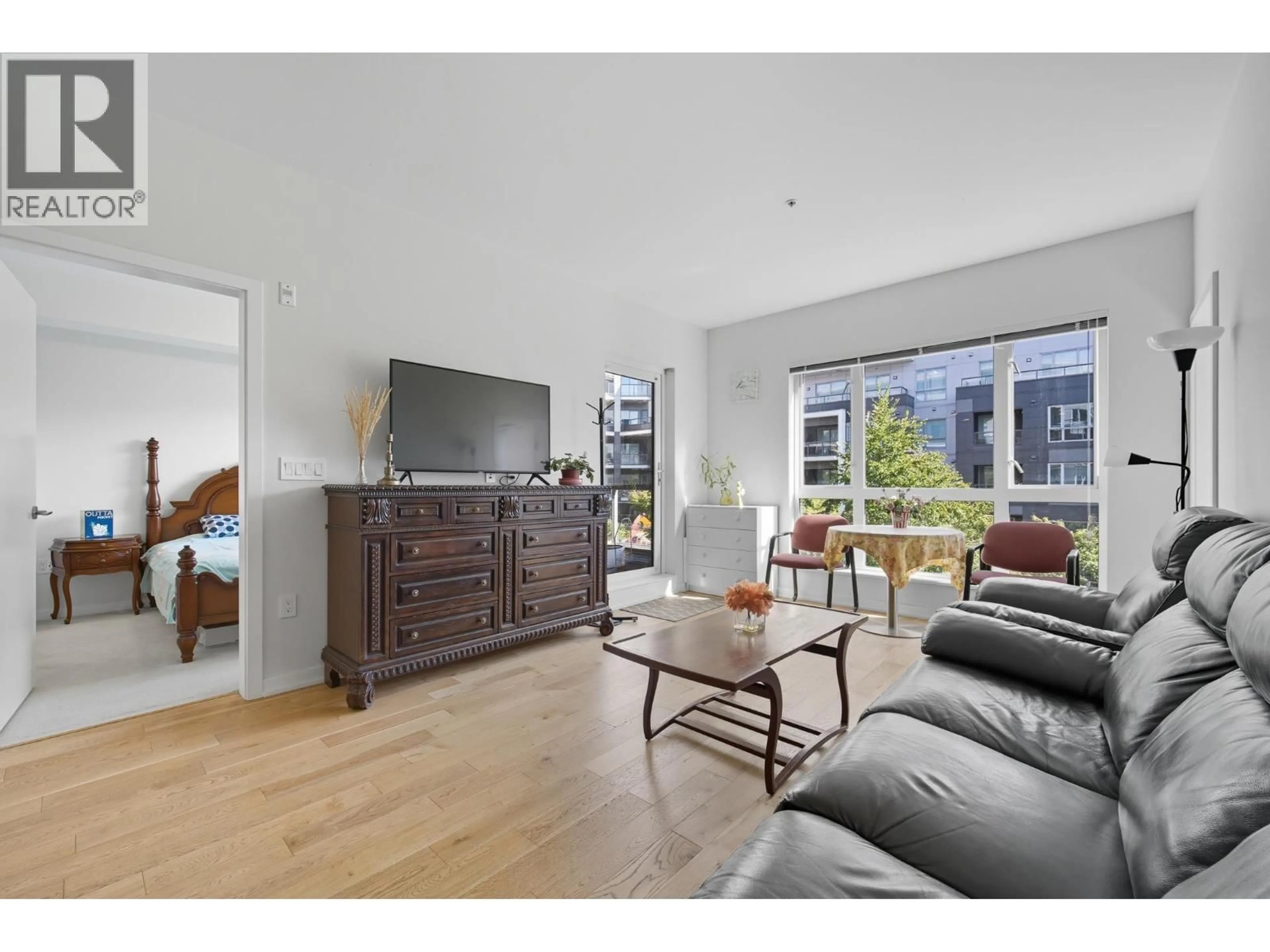 Living room with furniture, wood/laminate floor for 332 - 7008 RIVER PARKWAY, Richmond British Columbia V6X0R1
