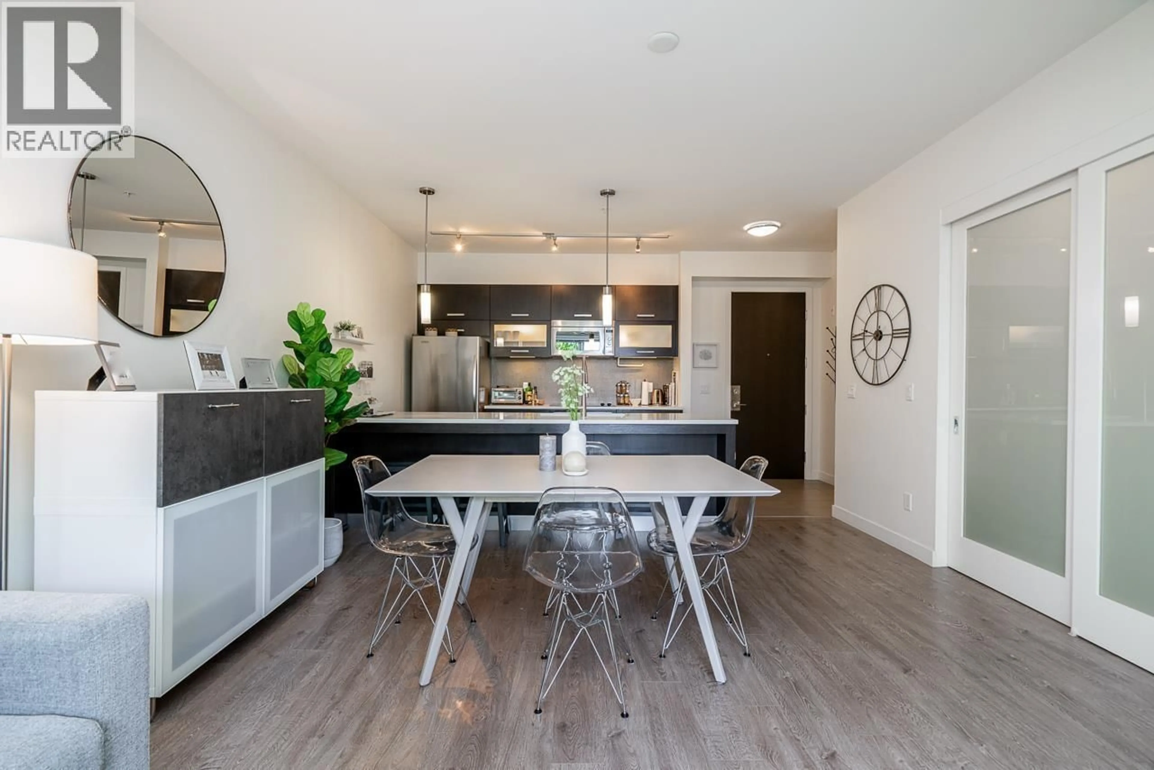 Open concept kitchen, wood/laminate floor for 321 - 3333 MAIN STREET, Vancouver British Columbia V5V3M8