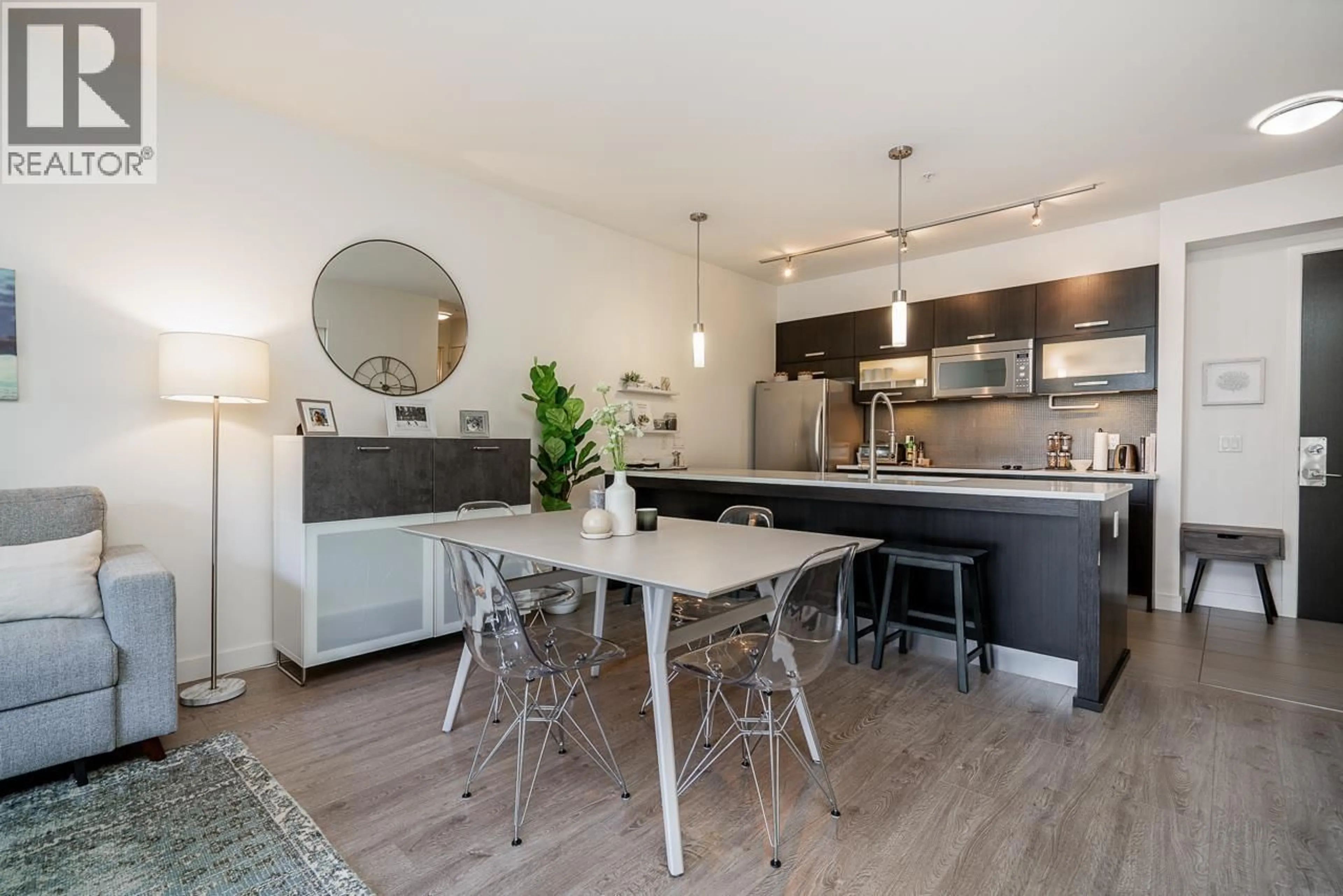 Open concept kitchen, wood/laminate floor for 321 - 3333 MAIN STREET, Vancouver British Columbia V5V3M8